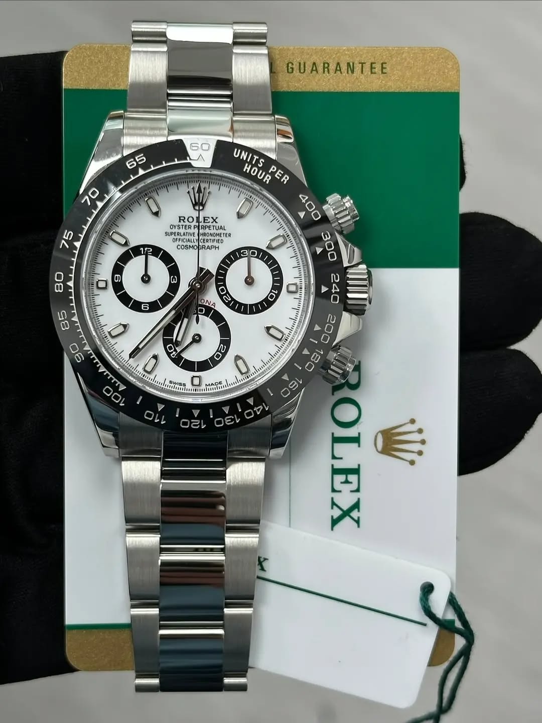 May be an image of wrist watch and text that says 'GUARANTEE ROL LEX SUPESTER UPERLATIVE SUPERLATINE HESSCNSTEL 0 12 OM MOCRAPH RAPH a ONA 10 Q 85 90 UNITS HOUR s ER 400 300 A 240…