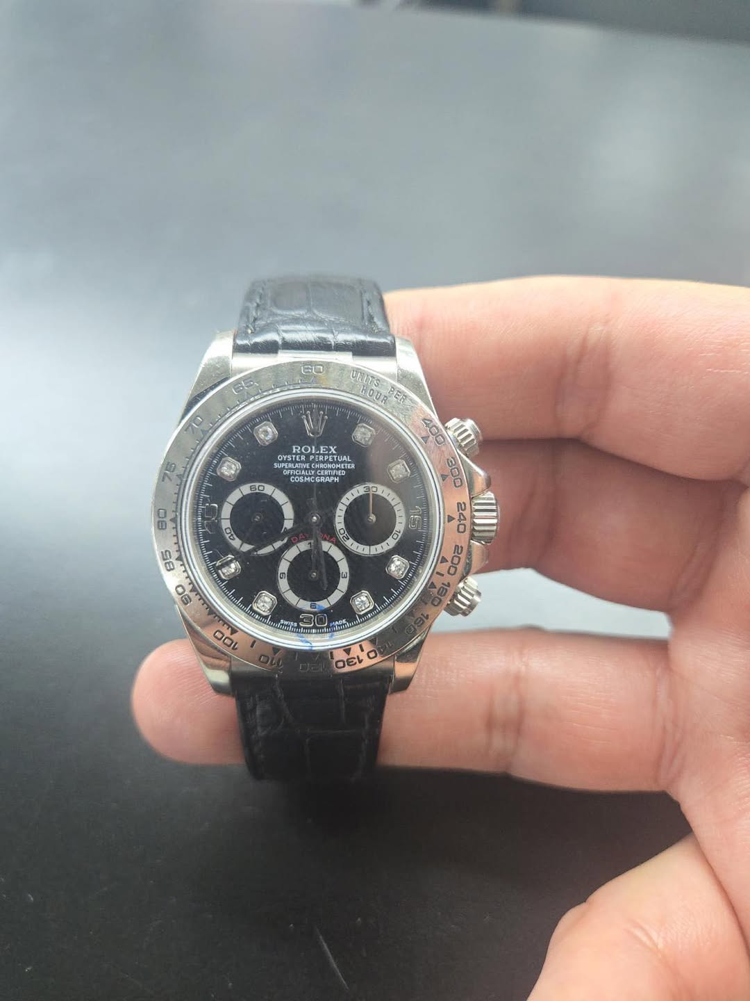 May be an image of wrist watch and text