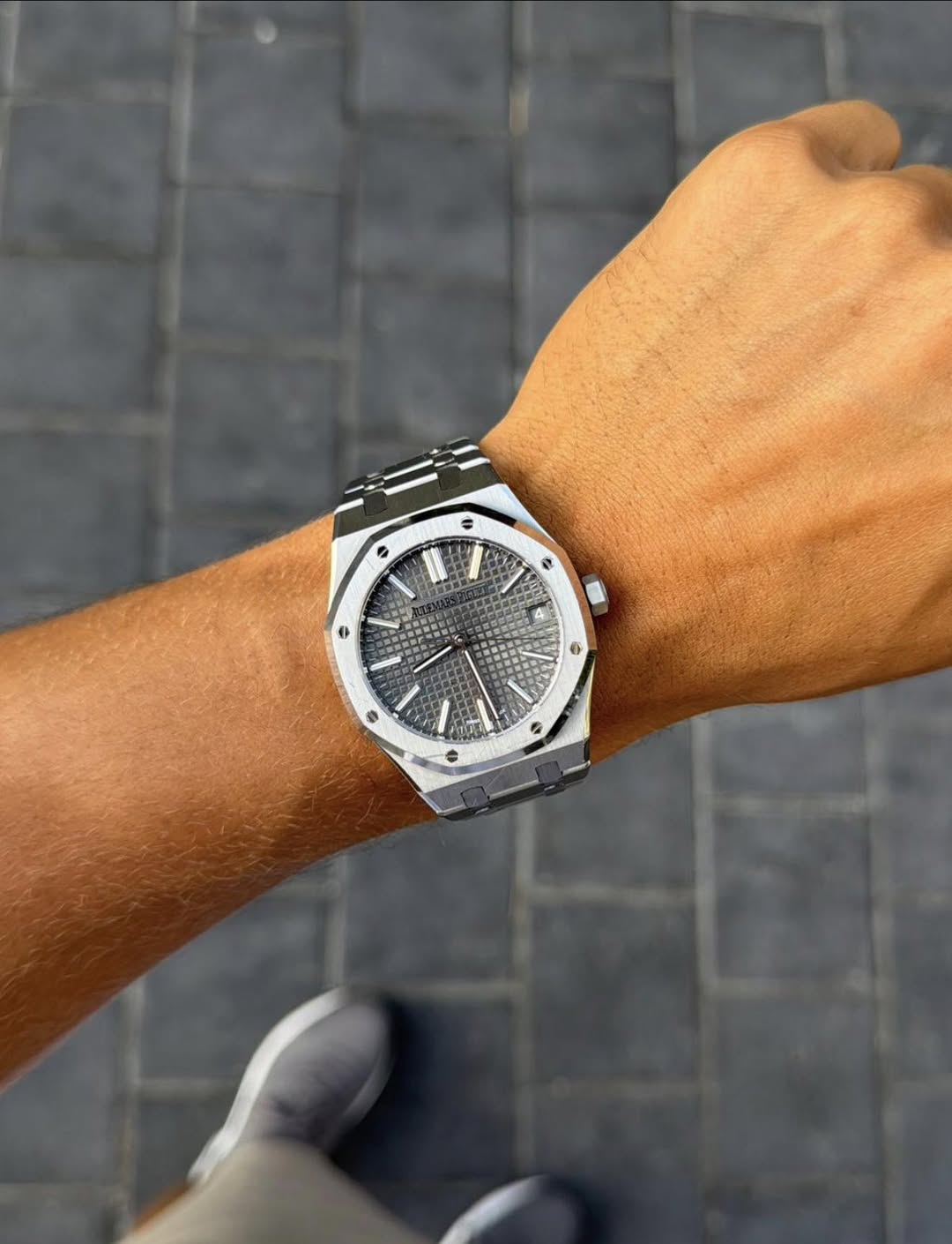 May be an image of wrist watch and text