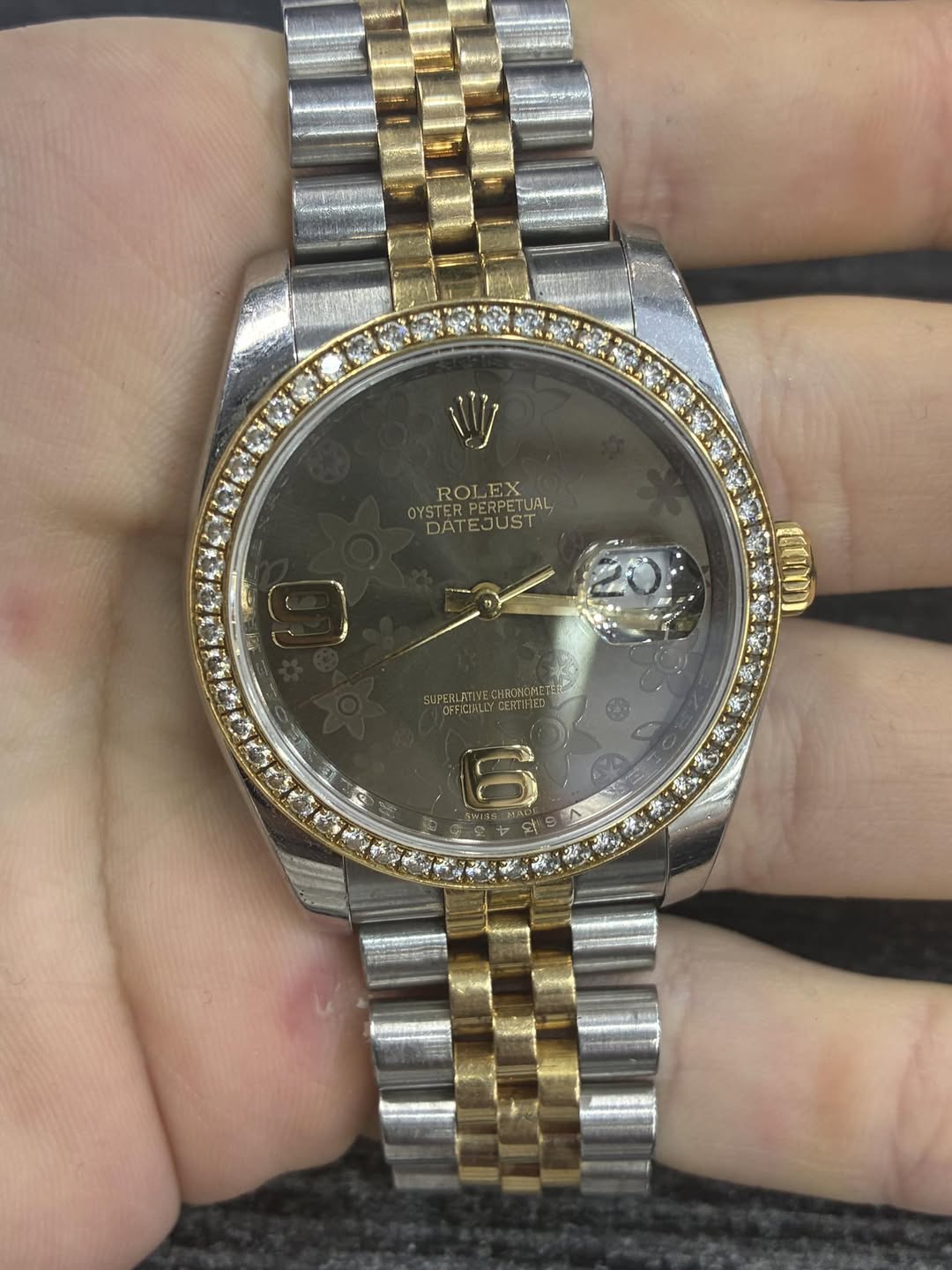 May be an image of wrist watch and text