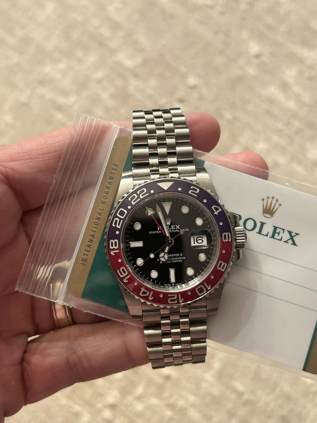 May be an image of wrist watch and text