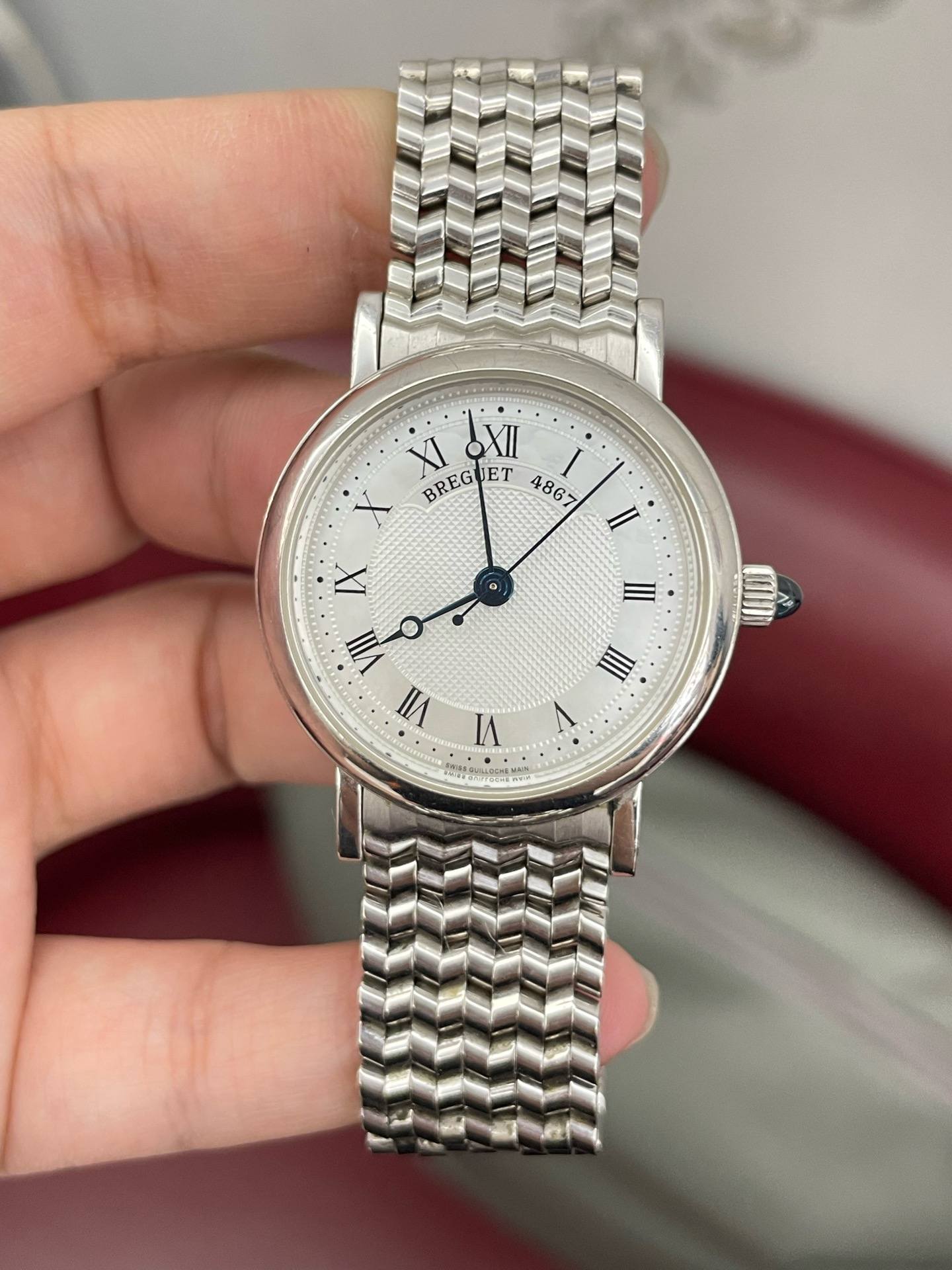 May be an image of wrist watch and text
