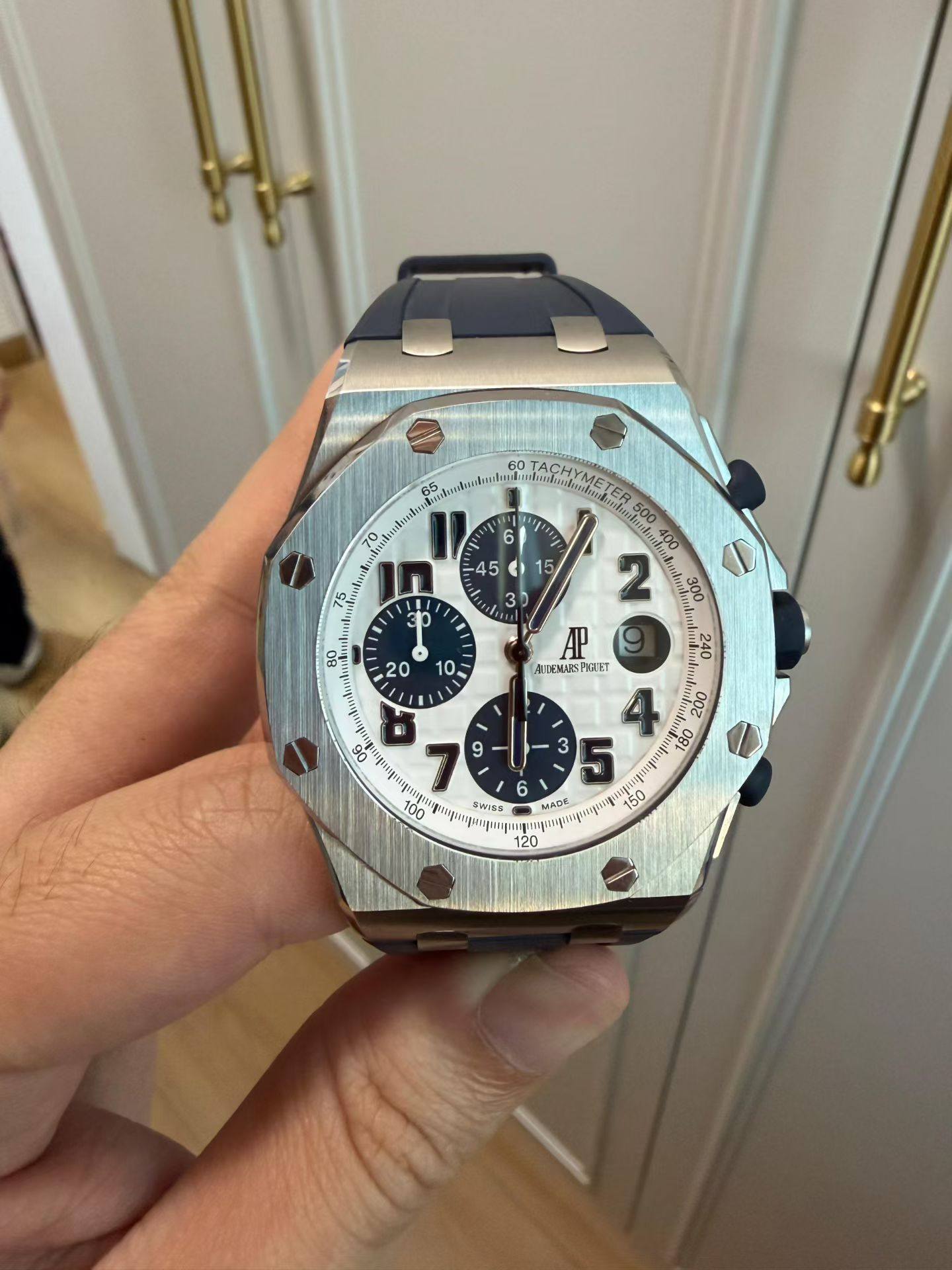 May be an image of wrist watch and text