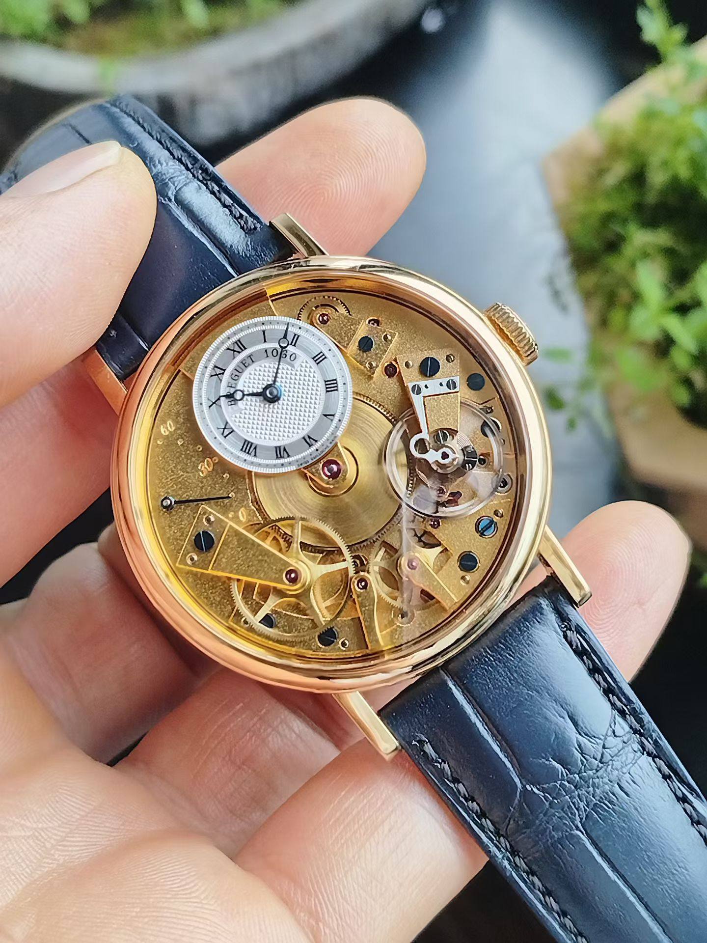May be an image of wrist watch and text