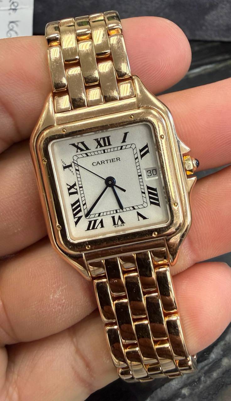 May be an image of wrist watch and text