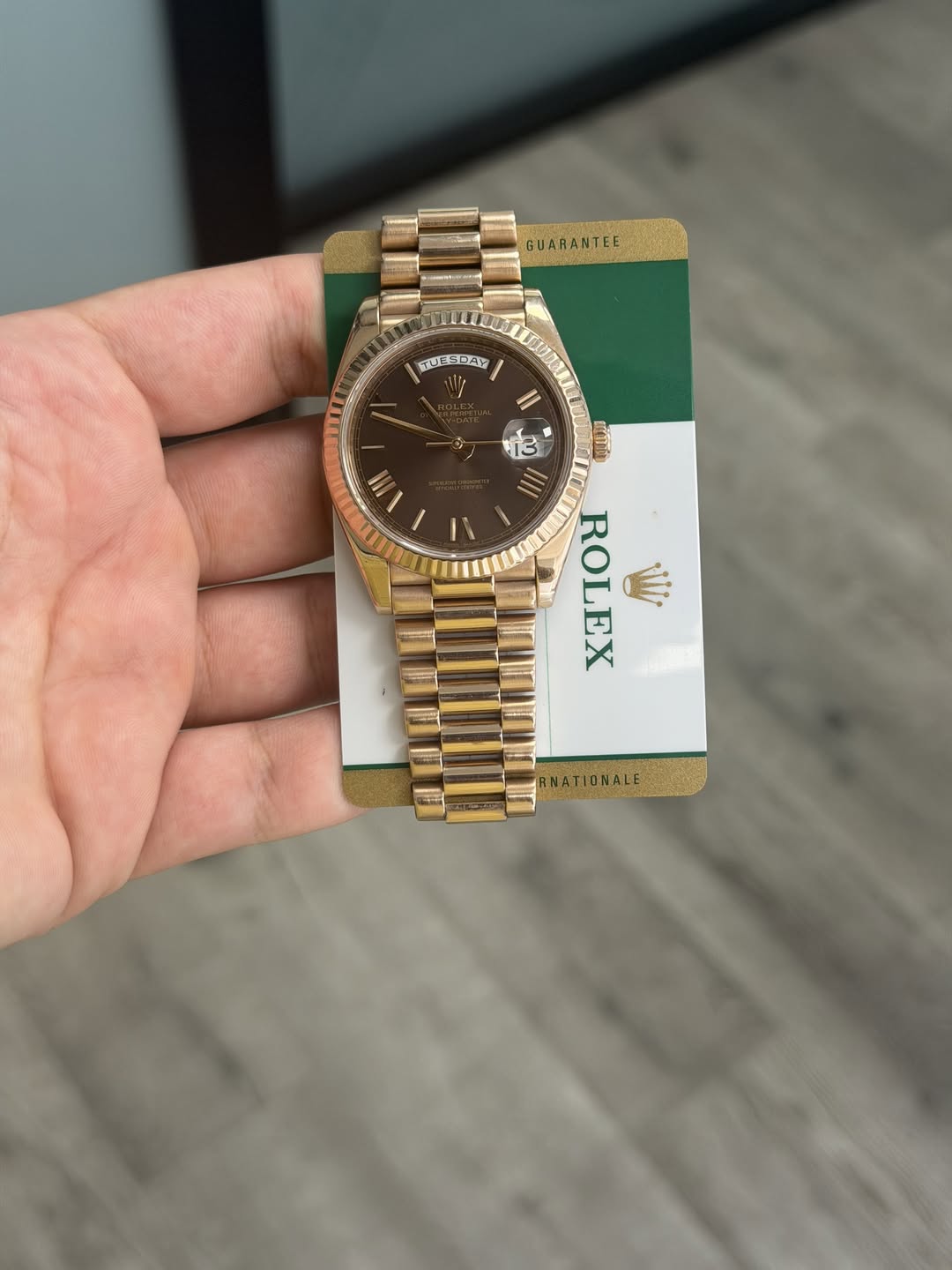 May be an image of wrist watch and text