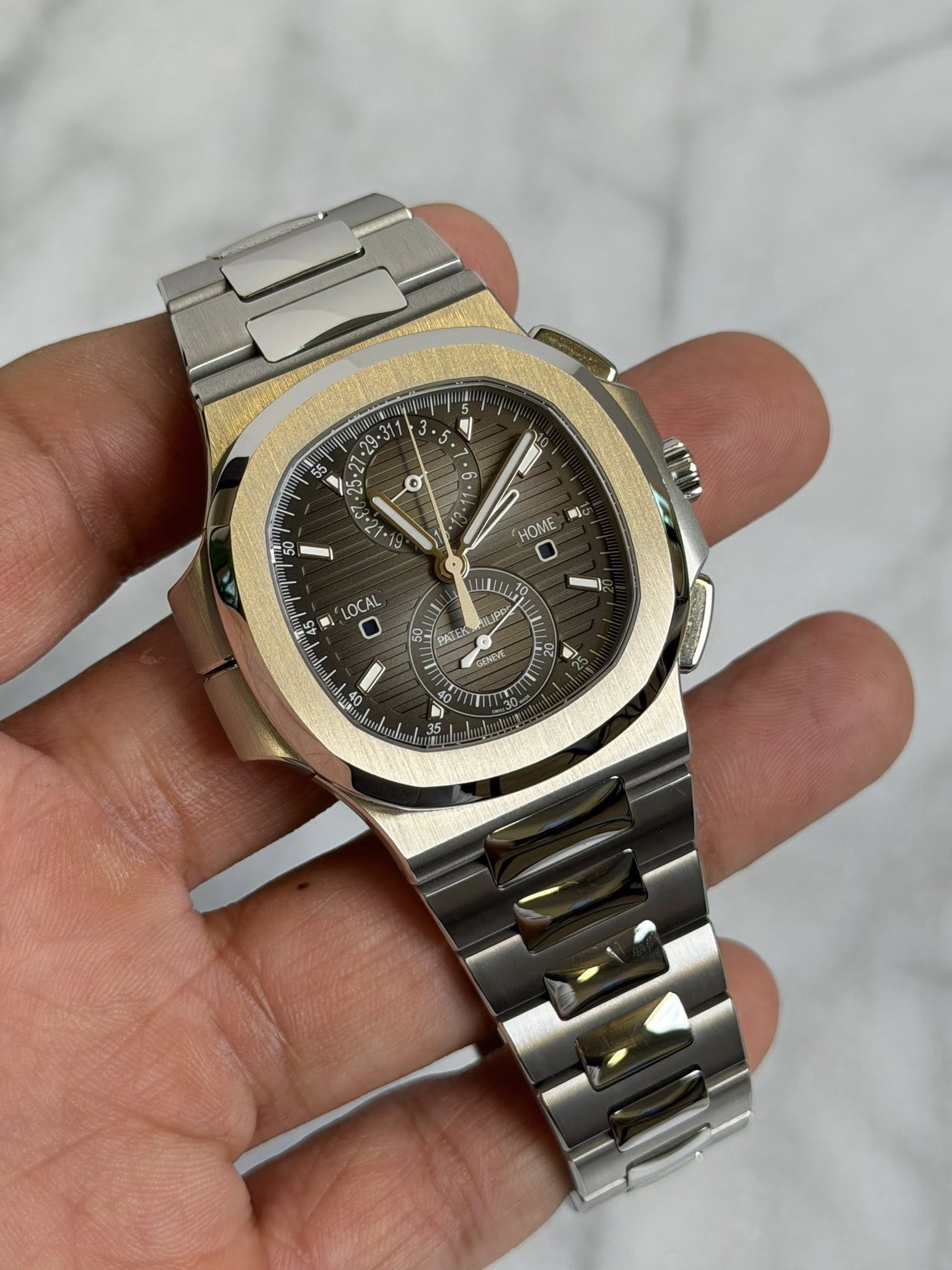 May be an image of wrist watch and text that says '획 55 σ 6 03 HOME BÌ OCAL IL SN PALER GENEVR AN 송 و'