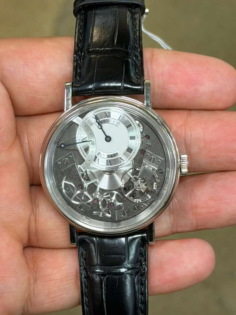May be an image of wrist watch and text