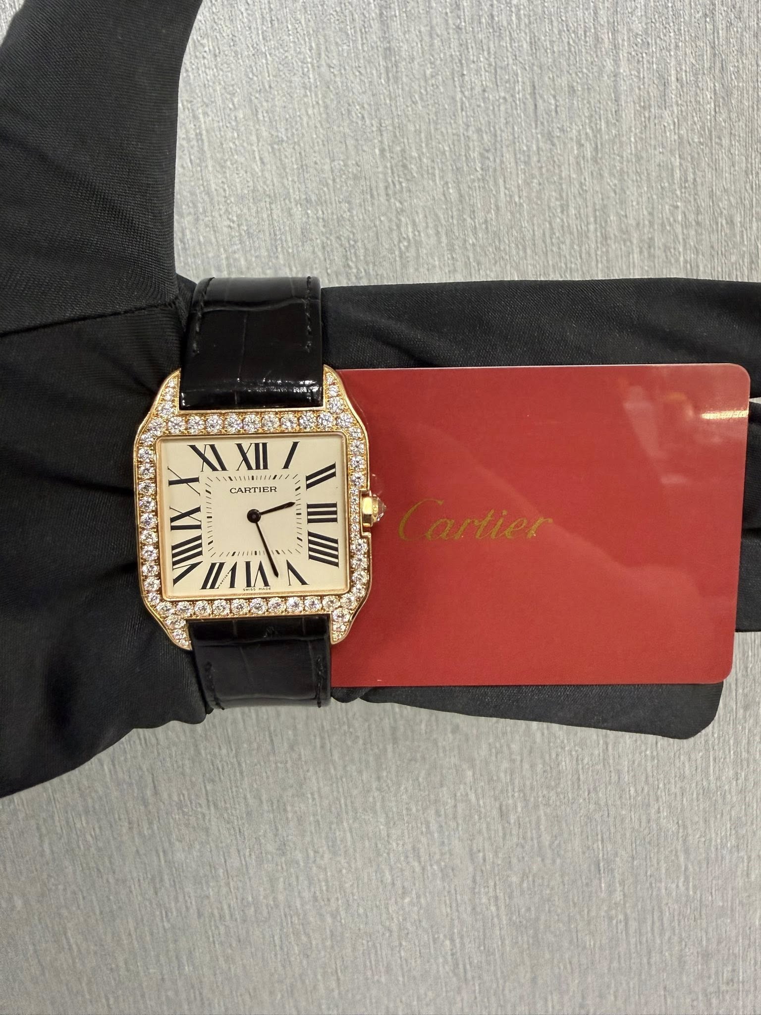 May be an image of wrist watch and text