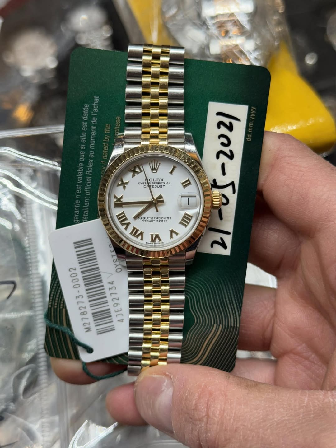 May be an image of wrist watch and text