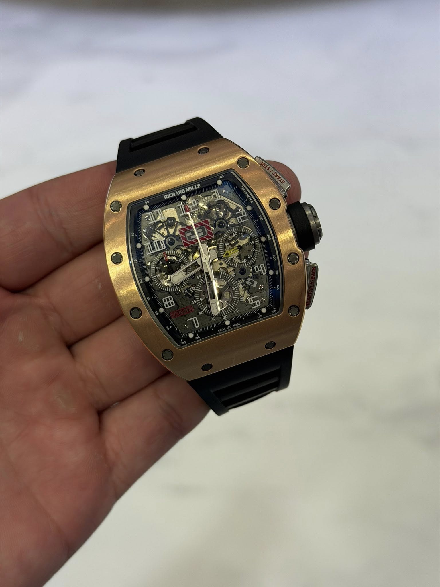 May be an image of wrist watch and text