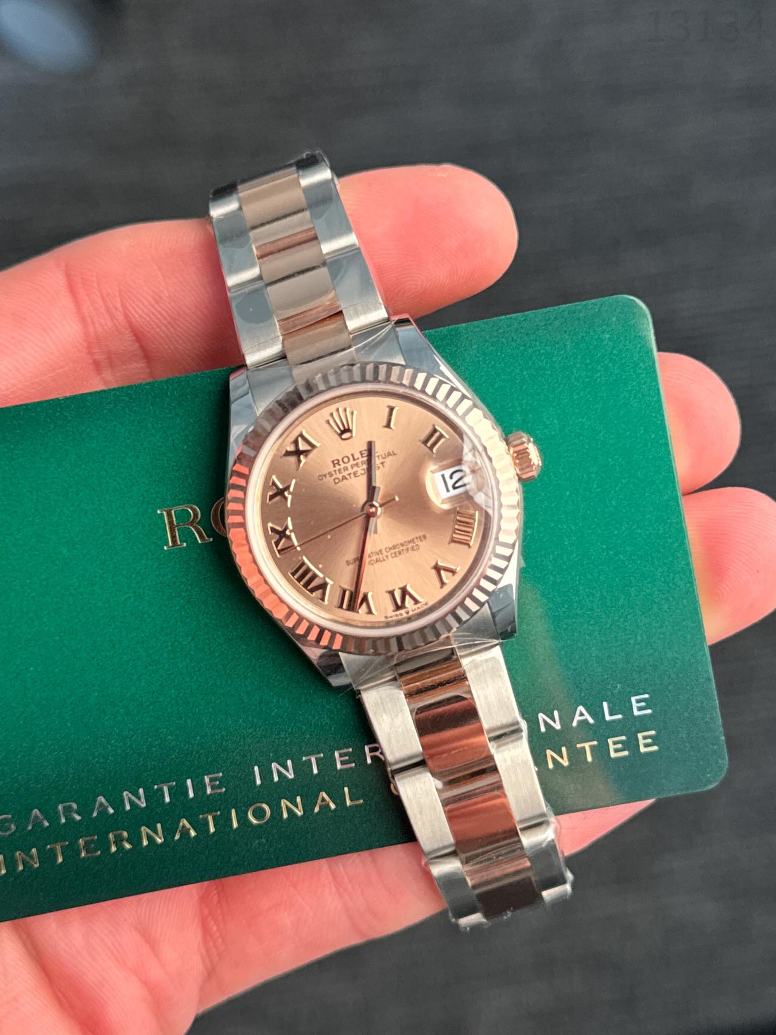 May be an image of wrist watch and text that says 'II W I XI ROL STERI TUAL X YSTERP DATES X VIII γμ V பர் R Pamn popKcTTa TIII NALE NTEE RANTIE ANTIE RNATIONAL RNATIONAL INTER'