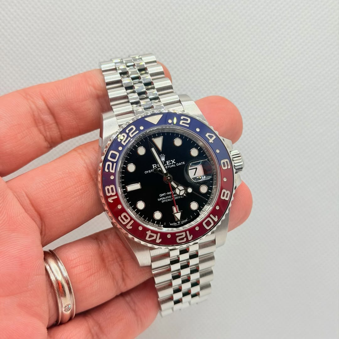 May be an image of wrist watch and text