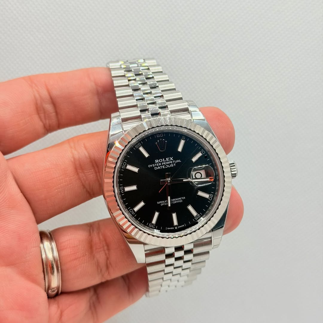 May be an image of wrist watch and text