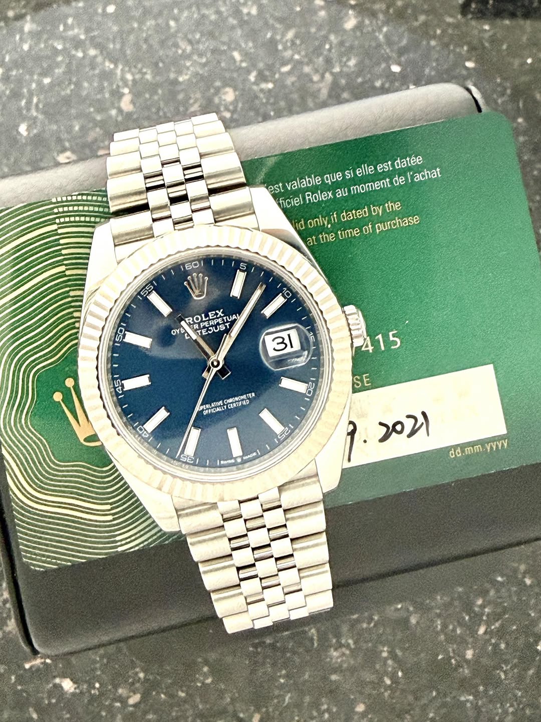 May be an image of wrist watch and text that says 'S-P-SS0 SP---S-N Si elle est datée est valable que ficiel Rolex au moment de achat id only, dated by the at the time…
