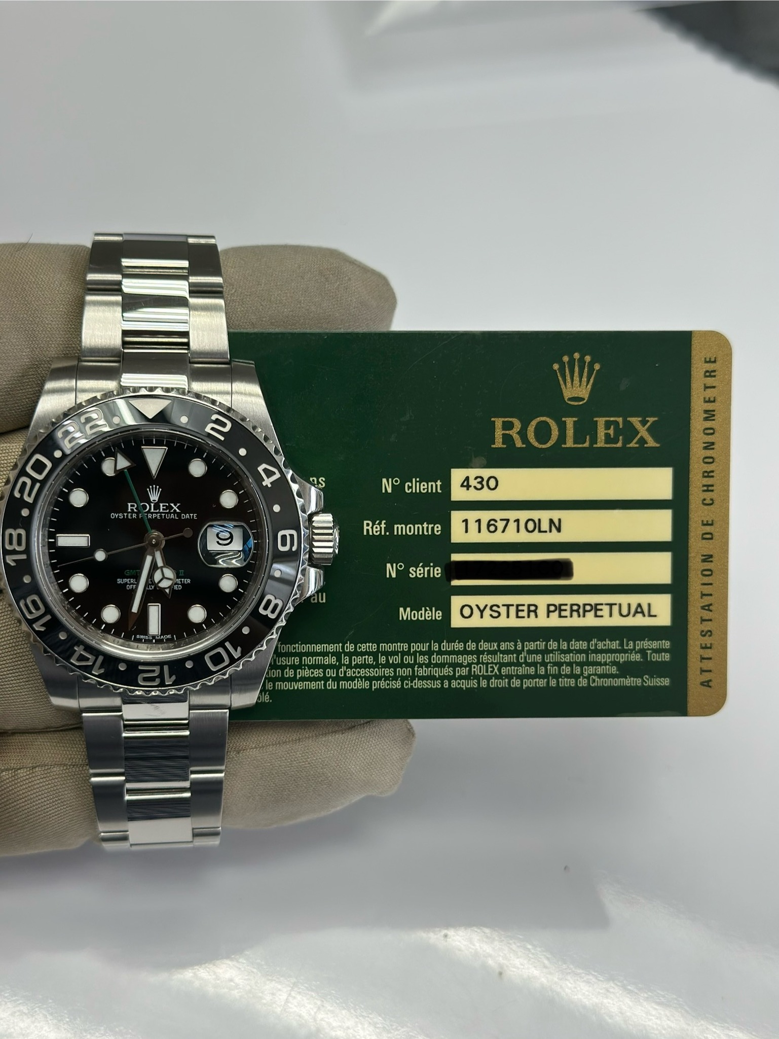 May be an image of wrist watch and text that says '2 20 Wh ROLEX CRFCTLALEAT DLEX 4 N° client ROLEX 430 د Réf. montre 116710LN N° série 00 O nouremen Modèle OYSTERPERPETUAL…
