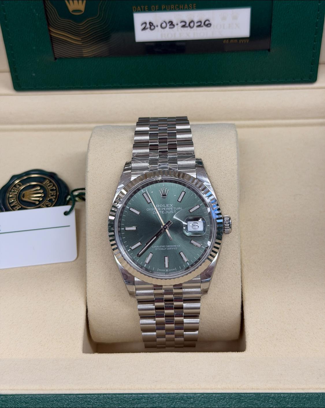 May be an image of wrist watch and text