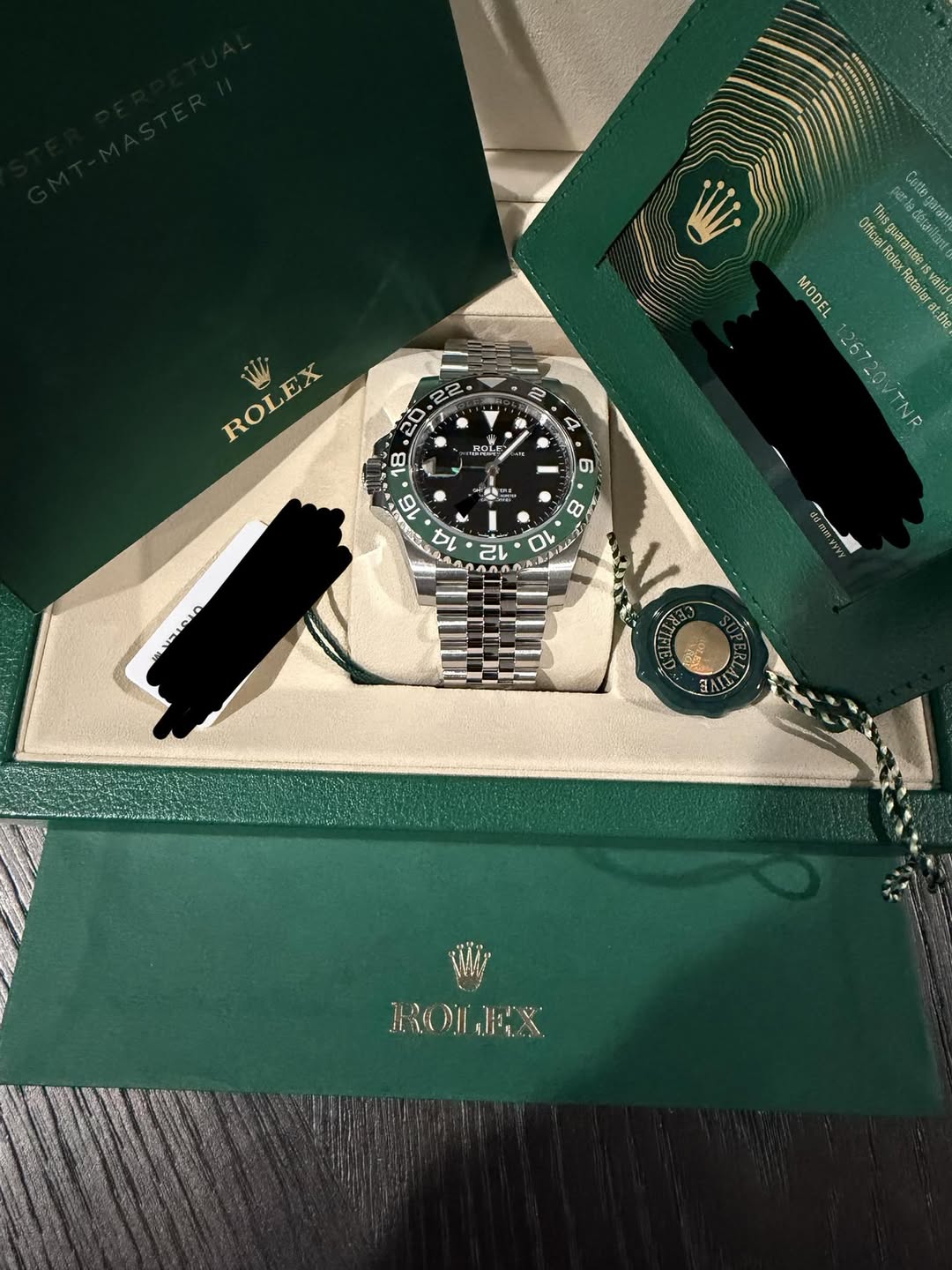 May be an image of wrist watch and text that says 'Cotle: Olficia 2 Thisguarantde Rolex M ታራያያው Votee រណ MODEL Retailer valid atthe 26720VTNR 26720VTNR OVTNR 22 2 ROLEX 4 ር5 4 -…