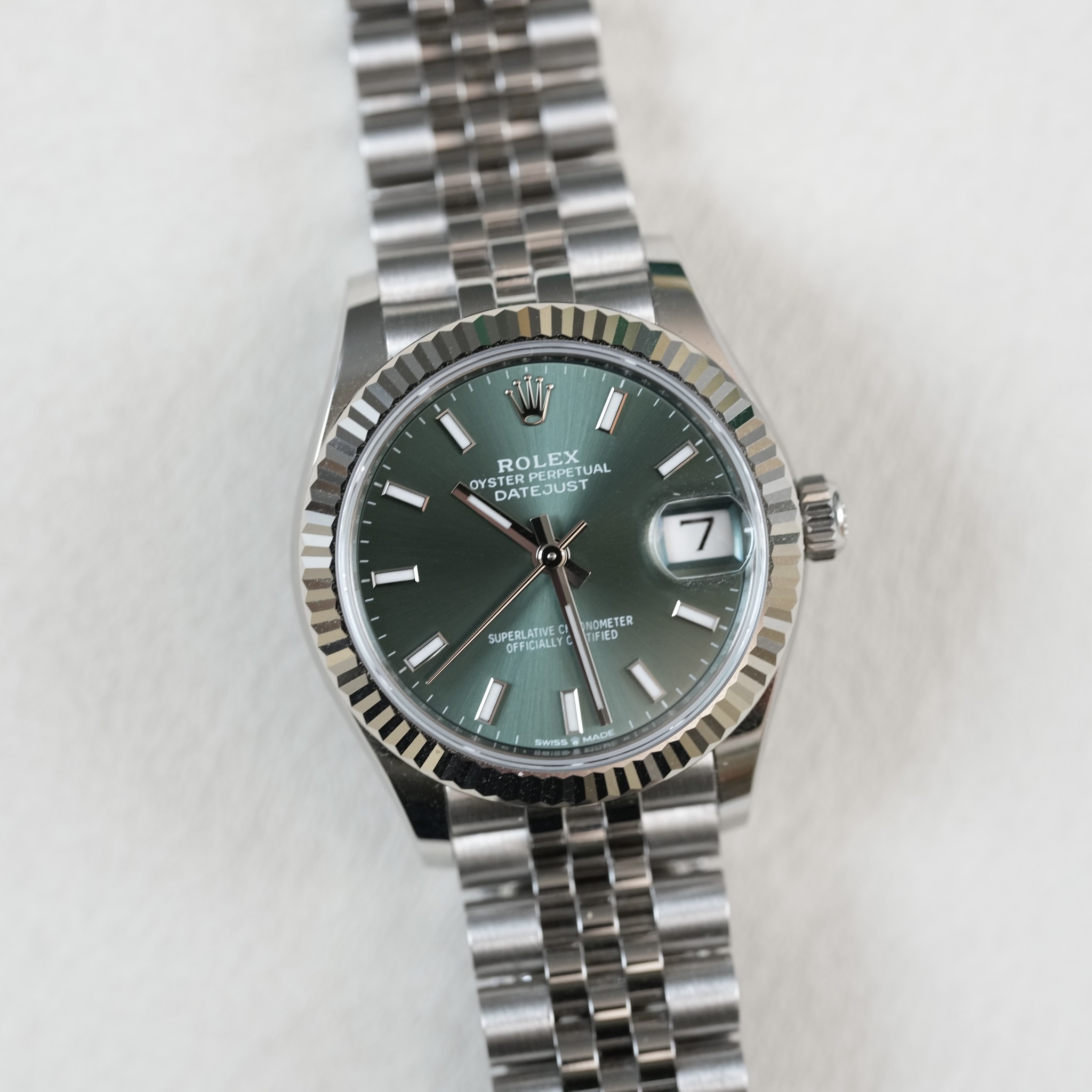May be an image of wrist watch and text