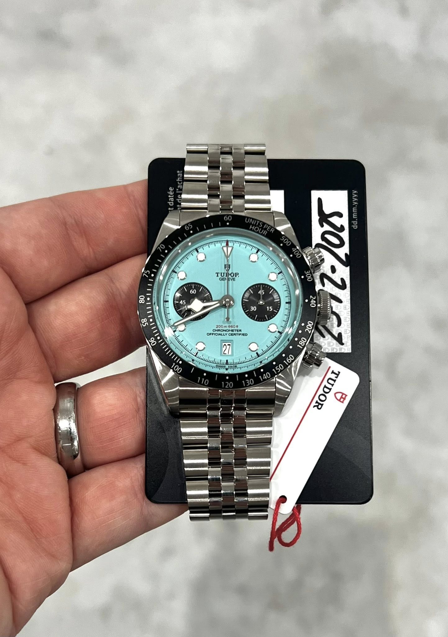 May be an image of wrist watch and text