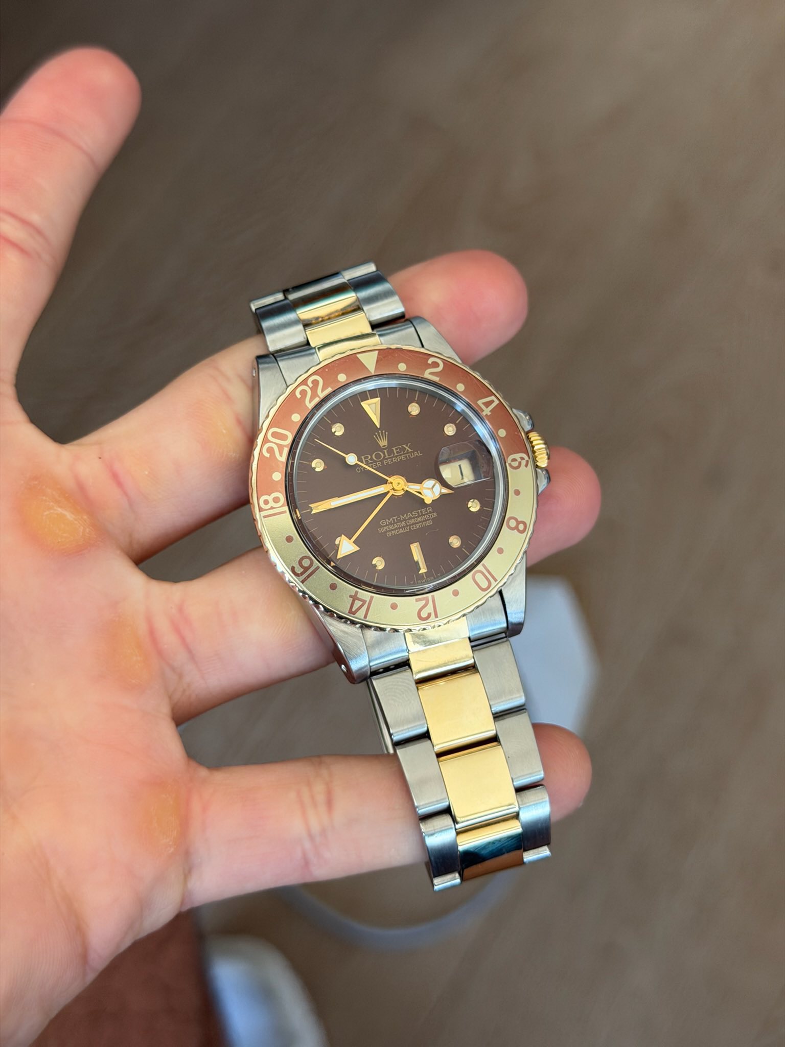 May be an image of wrist watch and text