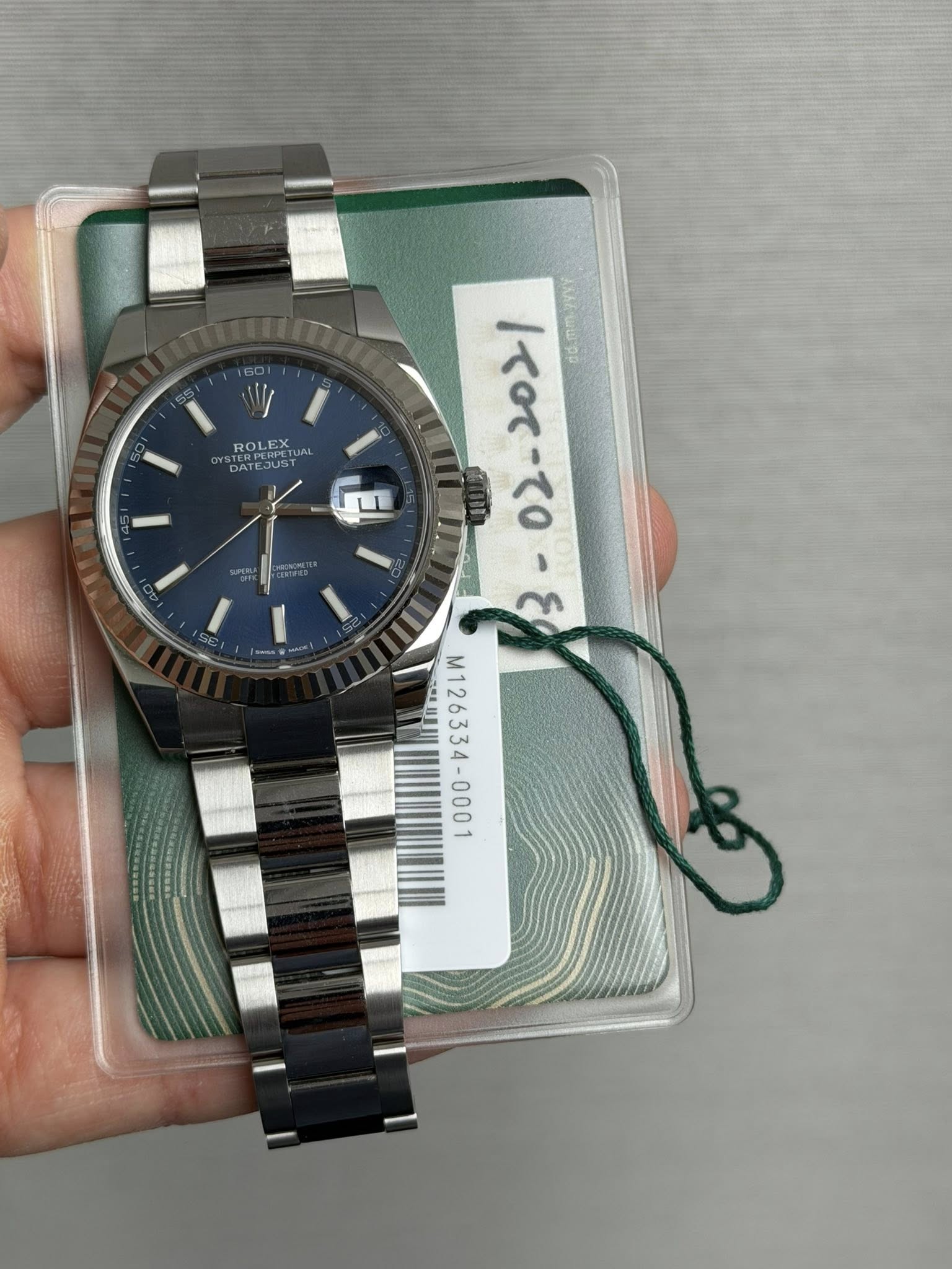 May be an image of wrist watch and text