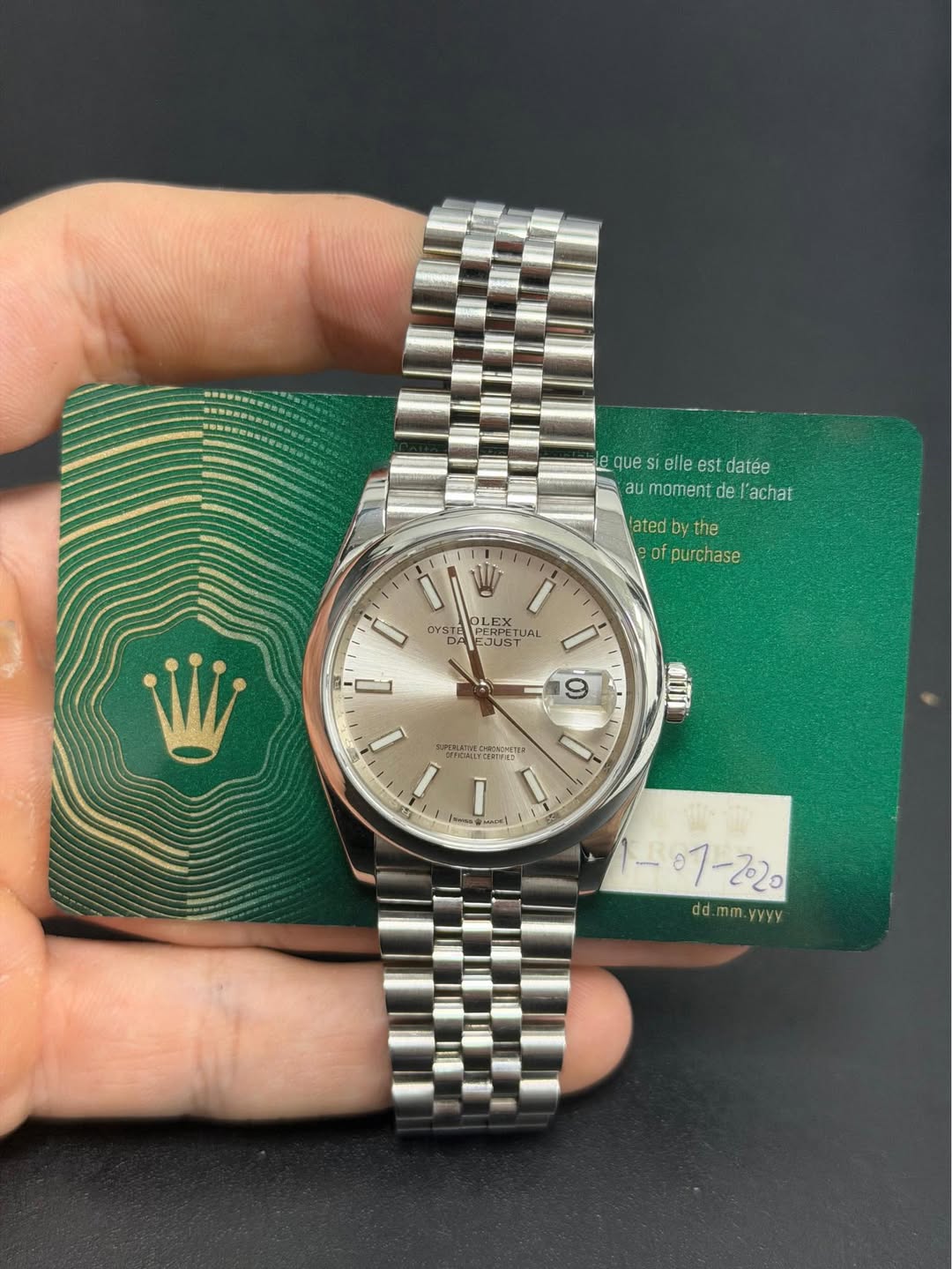 May be an image of wrist watch and text