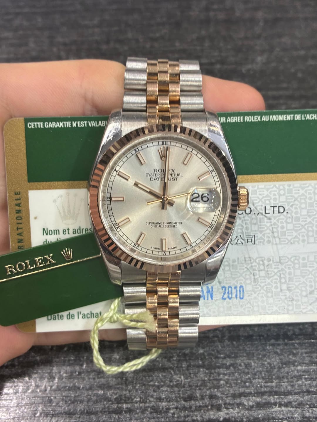 May be an image of wrist watch and text