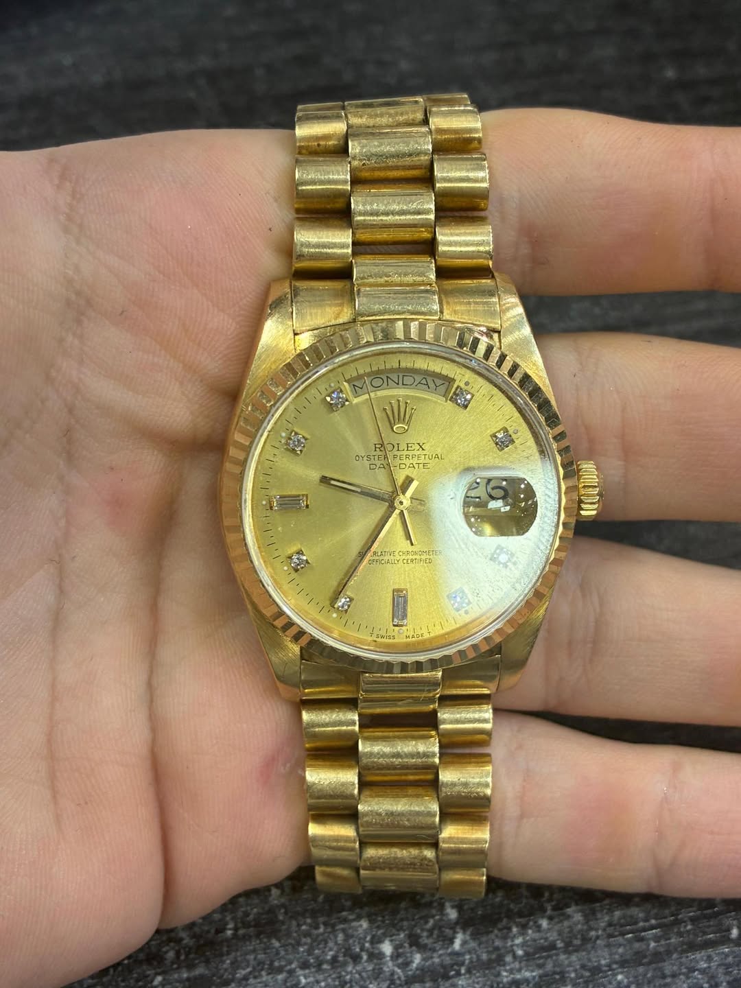 May be an image of wrist watch and text