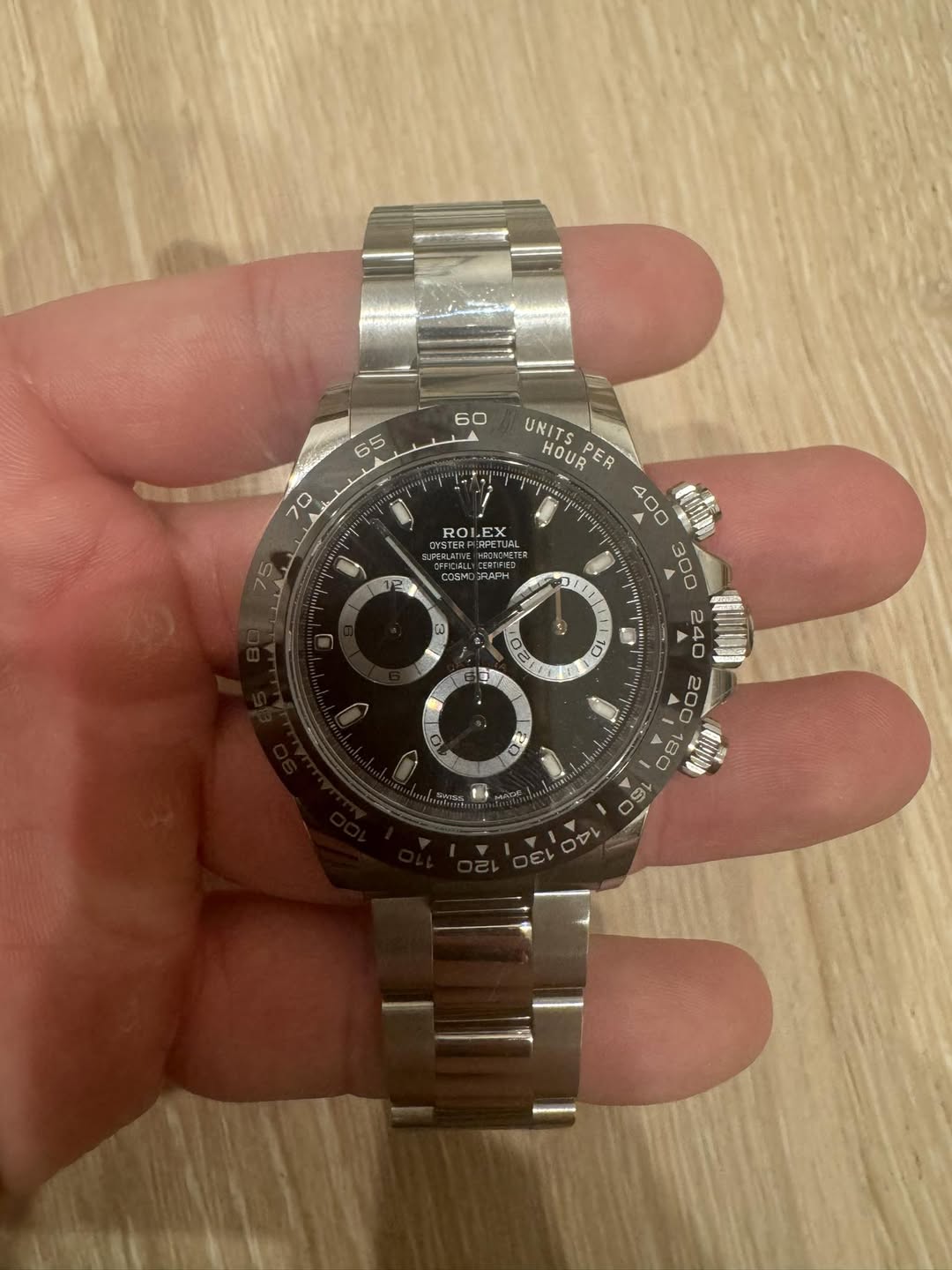 May be an image of wrist watch and text