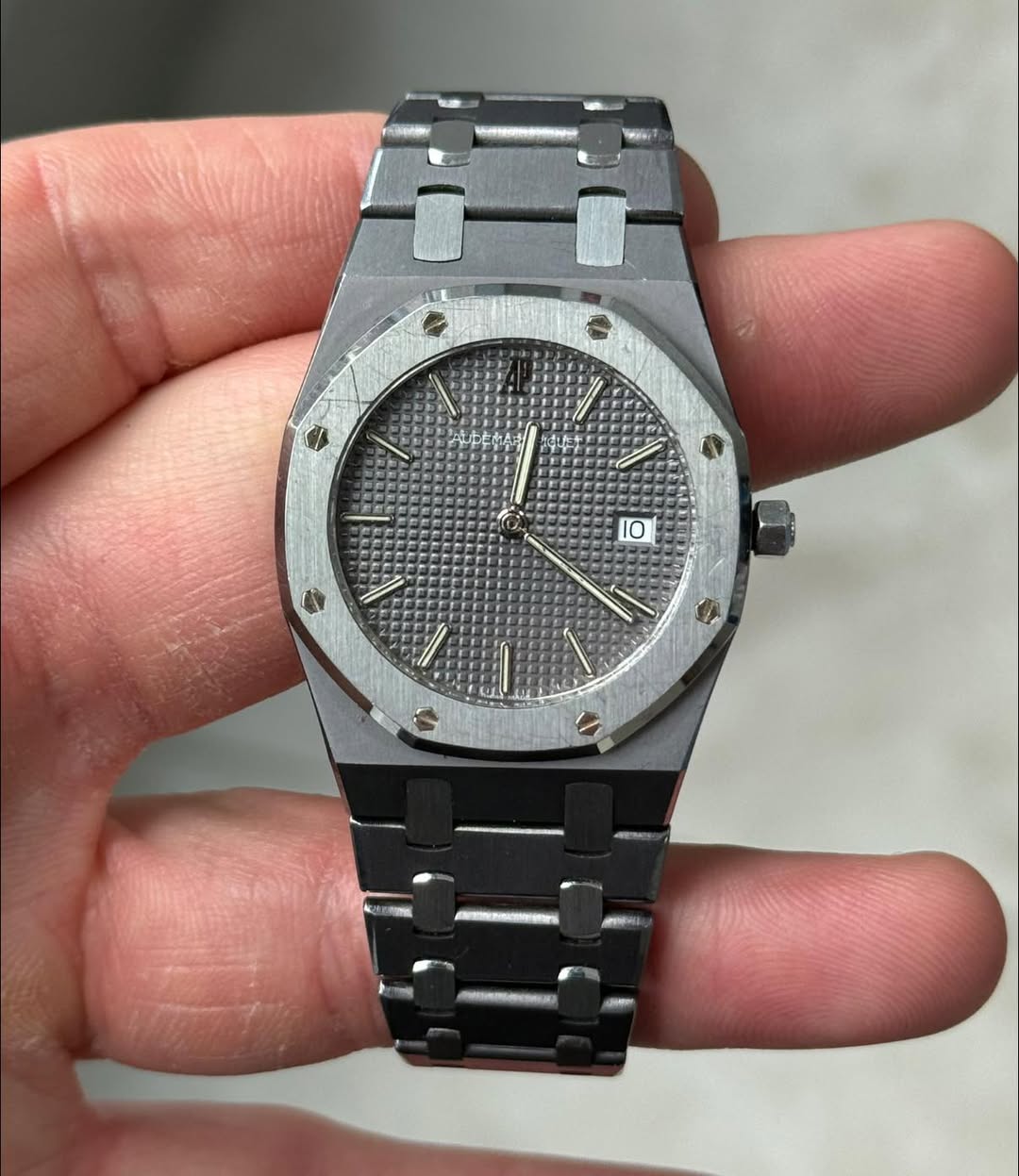 May be an image of wrist watch and text