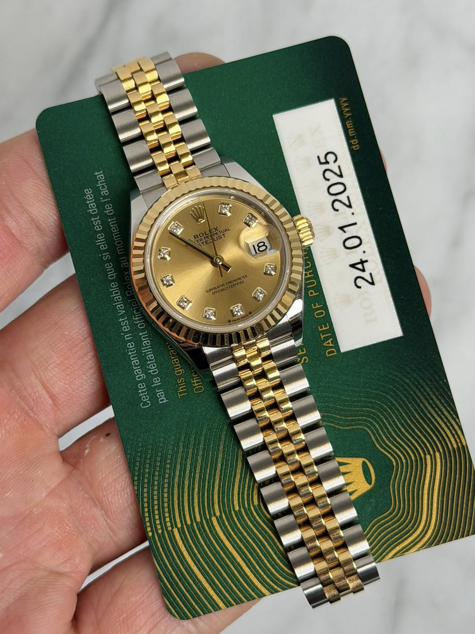 May be an image of wrist watch and text