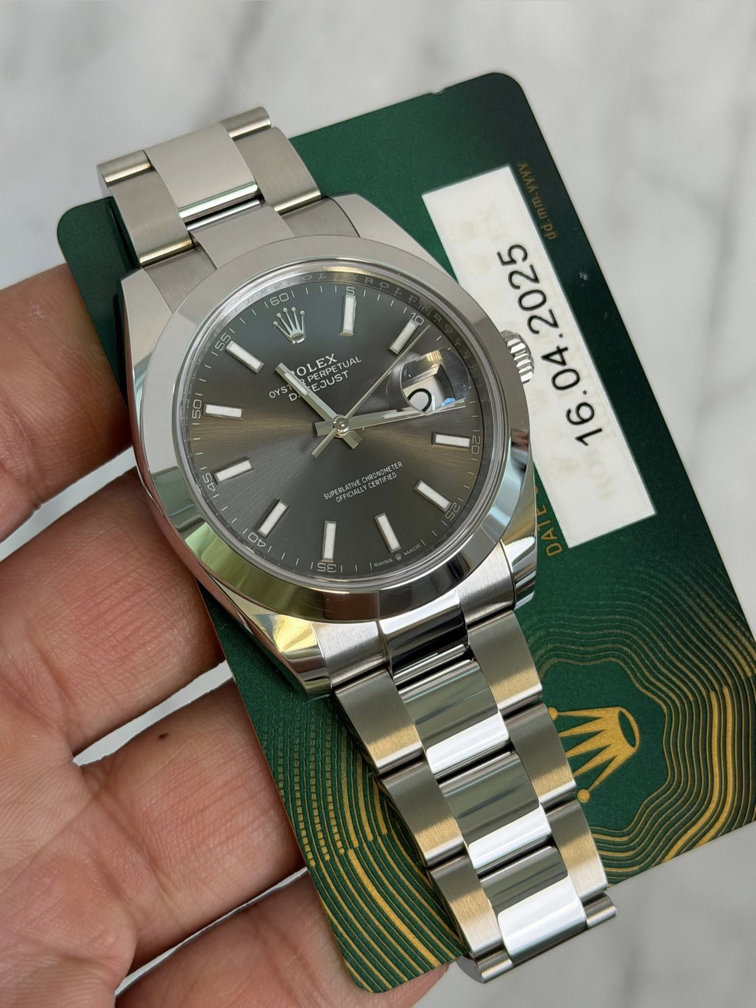 May be an image of wrist watch and text that says '60 55 OLEX T EJUST UAL oO SIAA . CHRONONETE 0 Ot 0V'