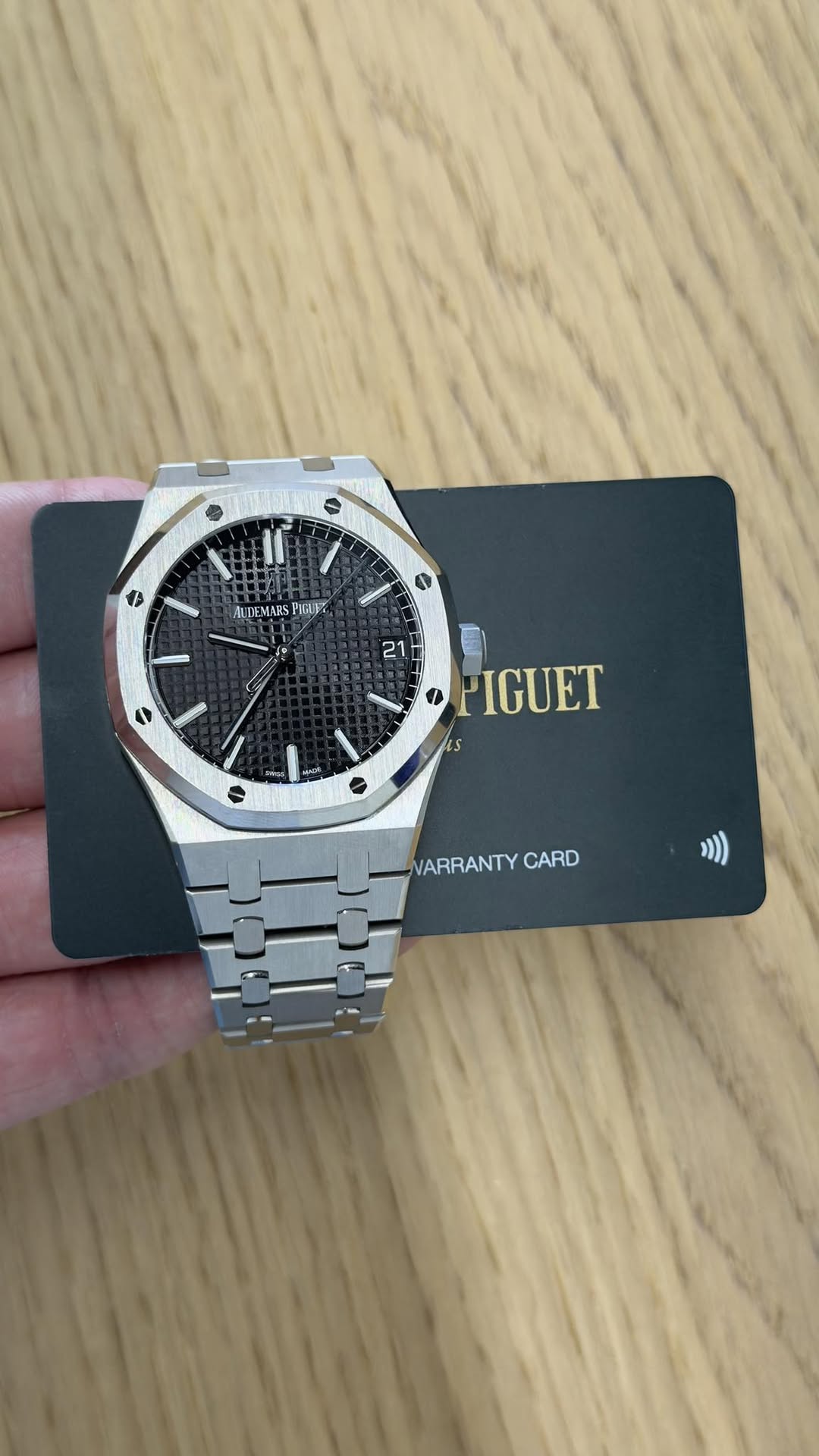 May be an image of wrist watch and text