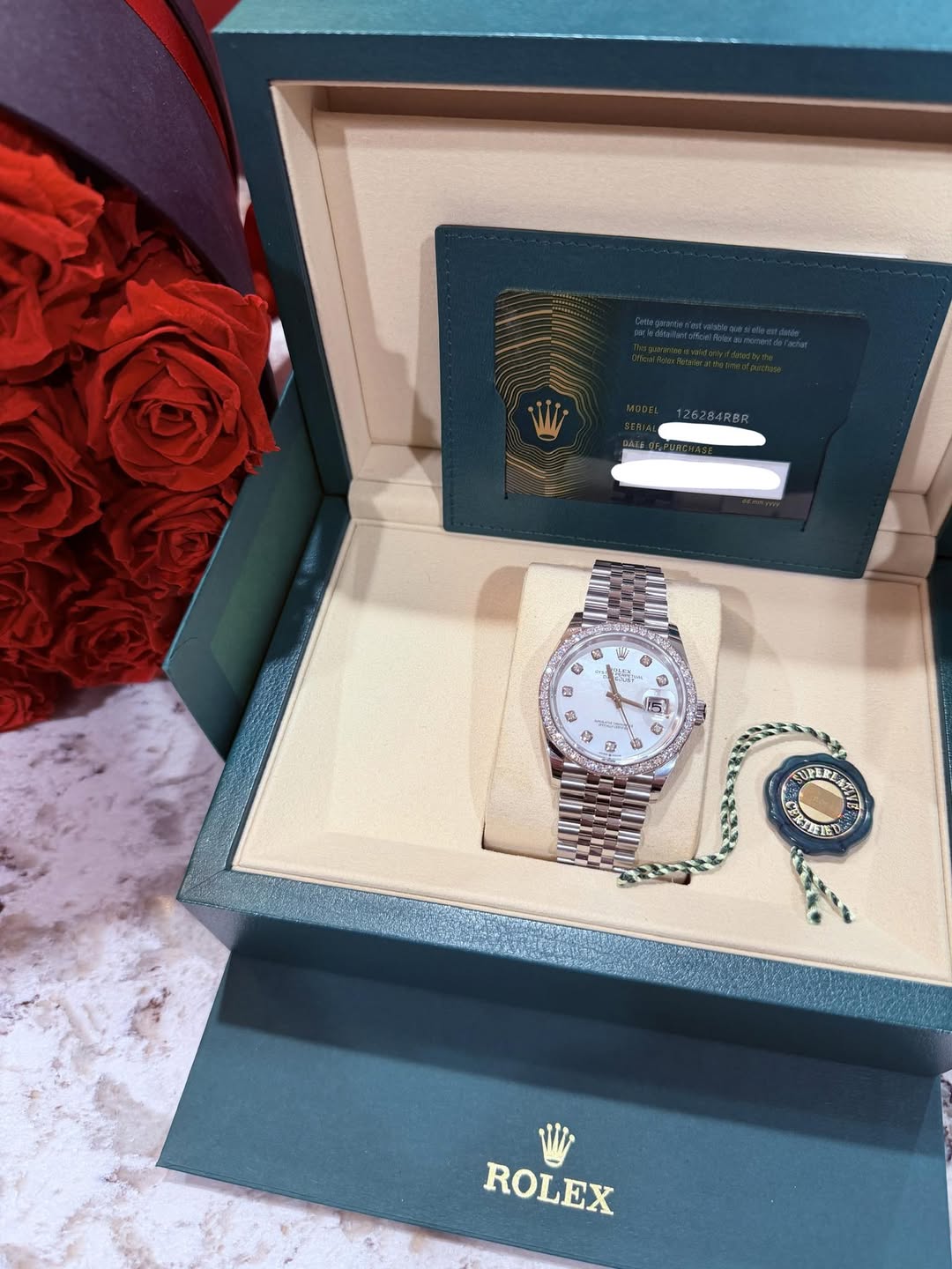 May be an image of wrist watch and text