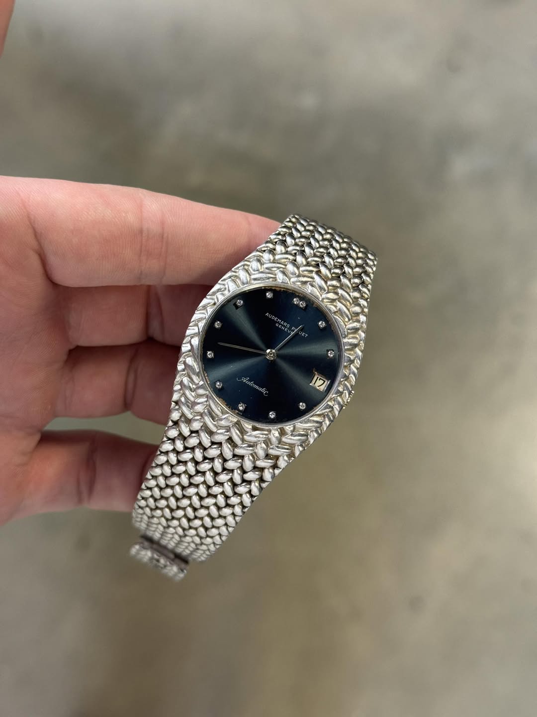 May be an image of wrist watch and text