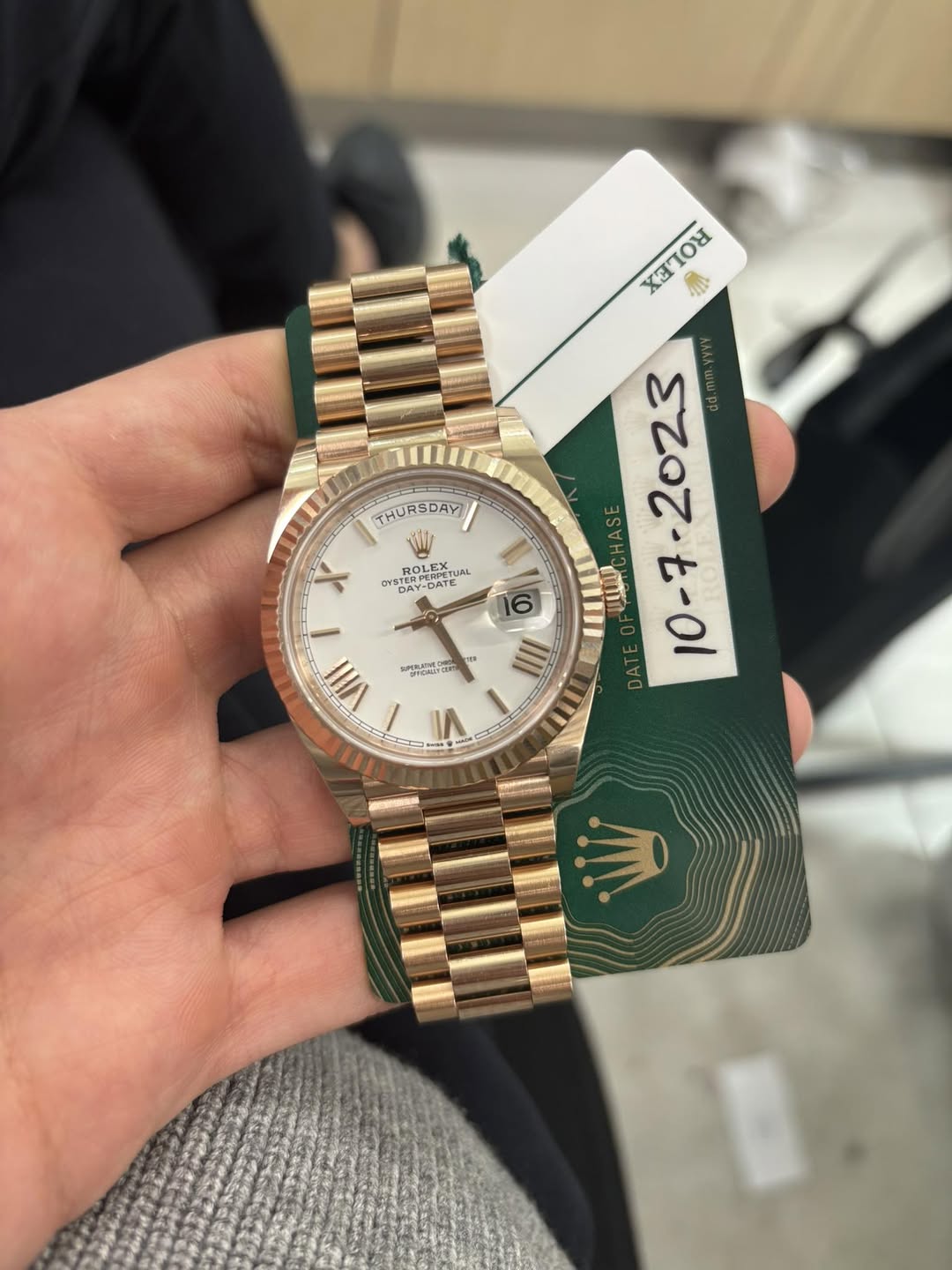 May be an image of wrist watch and text