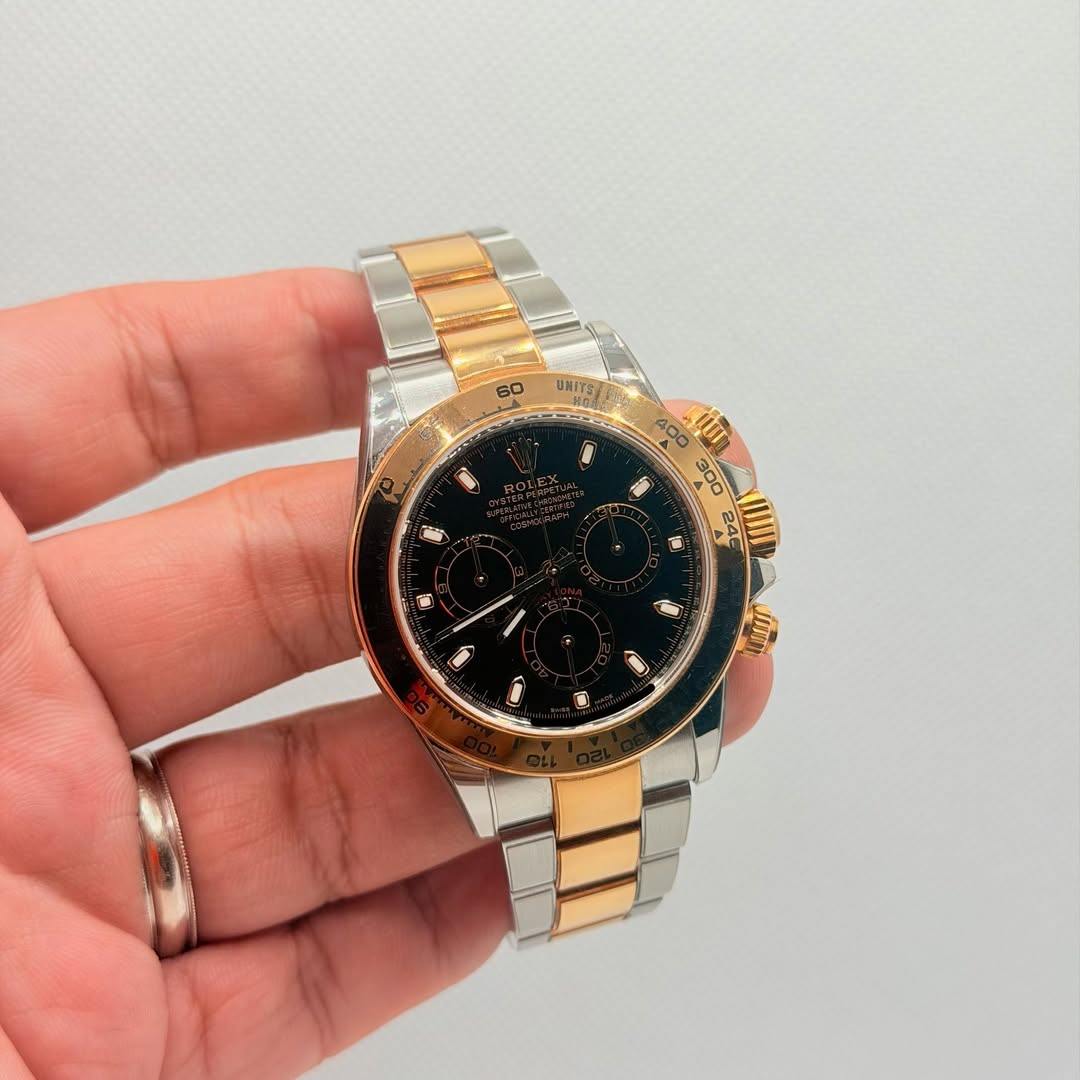 May be an image of wrist watch and text