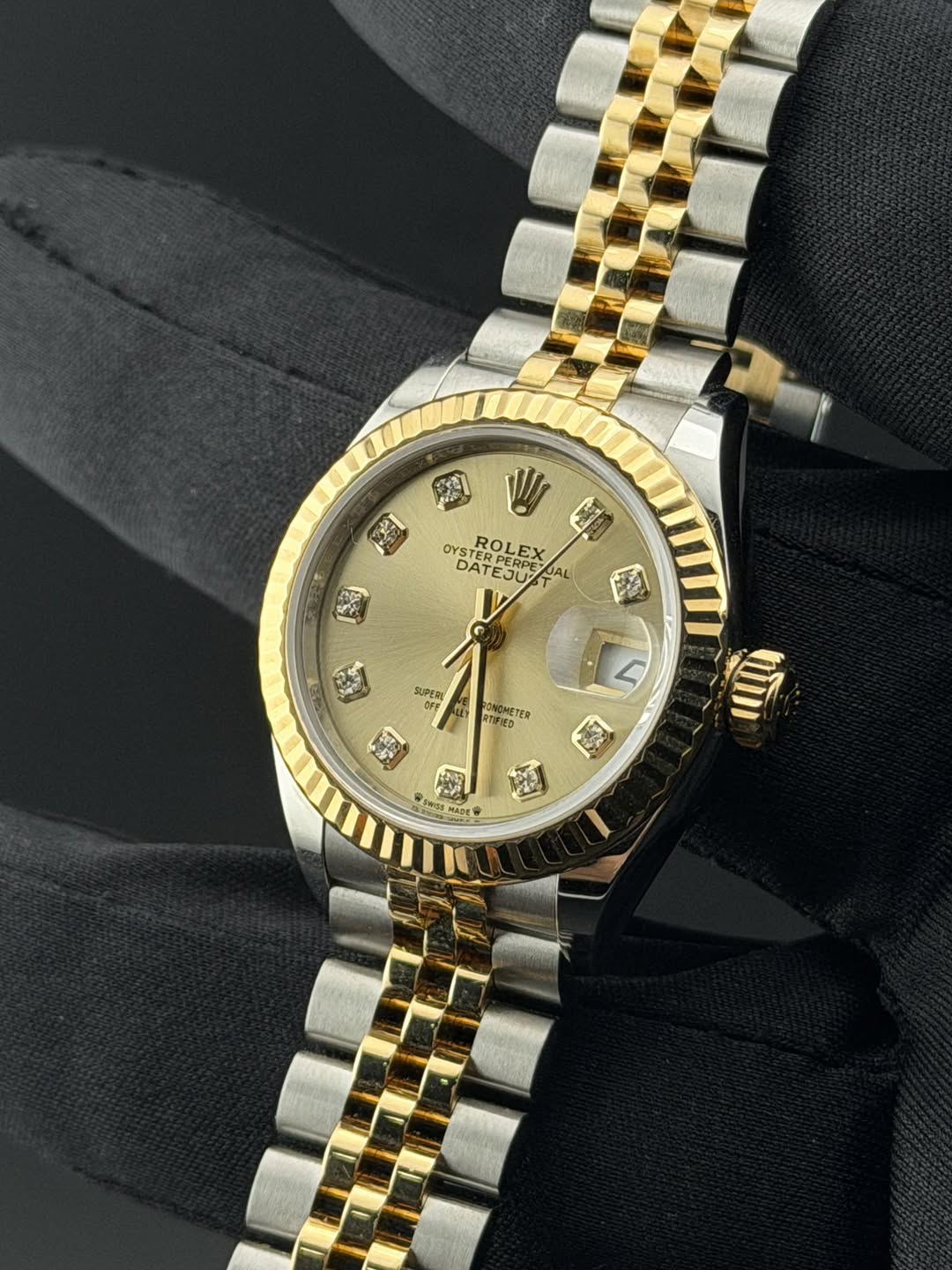 May be an image of wrist watch and text