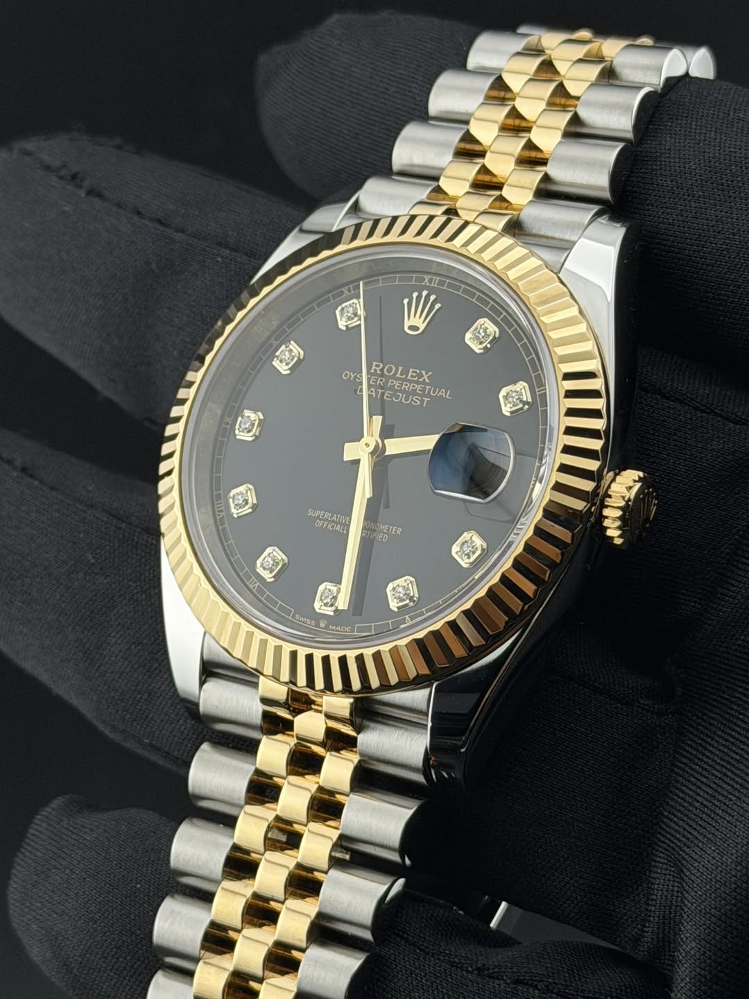 May be an image of wrist watch and text