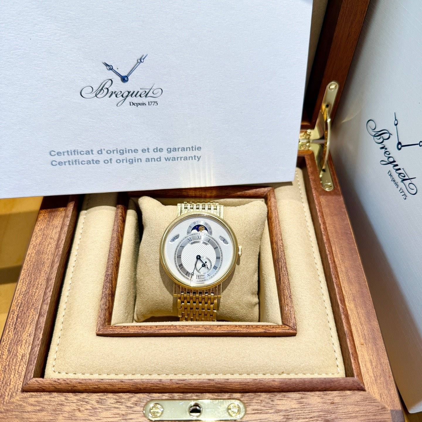 May be an image of wrist watch and text that says 'BKAи 1775 Depriis Certificat d' origine et de garantie Certificate of origin and warranty Bregueto Depales ส/ Bregueto VTTS'