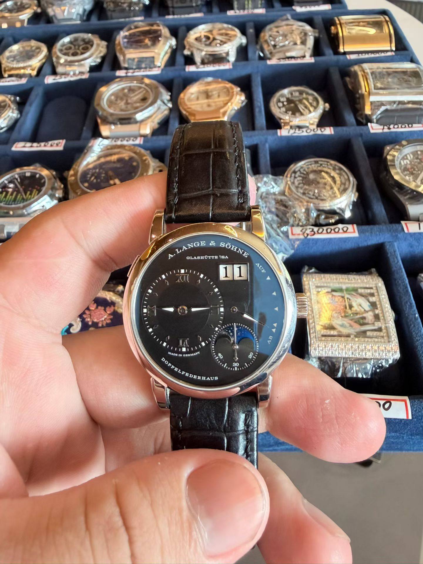 May be an image of wrist watch and text