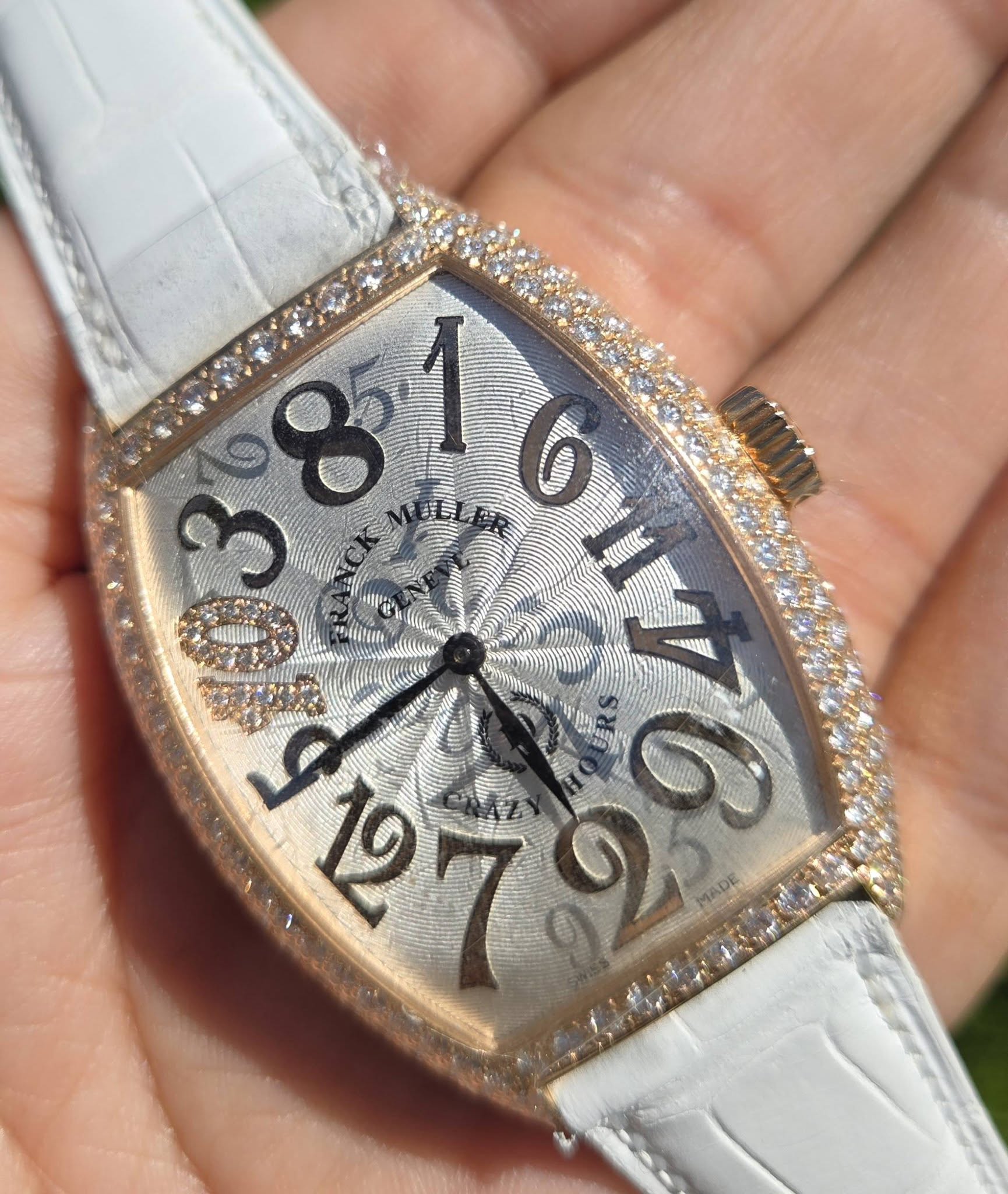 May be an image of wrist watch and text