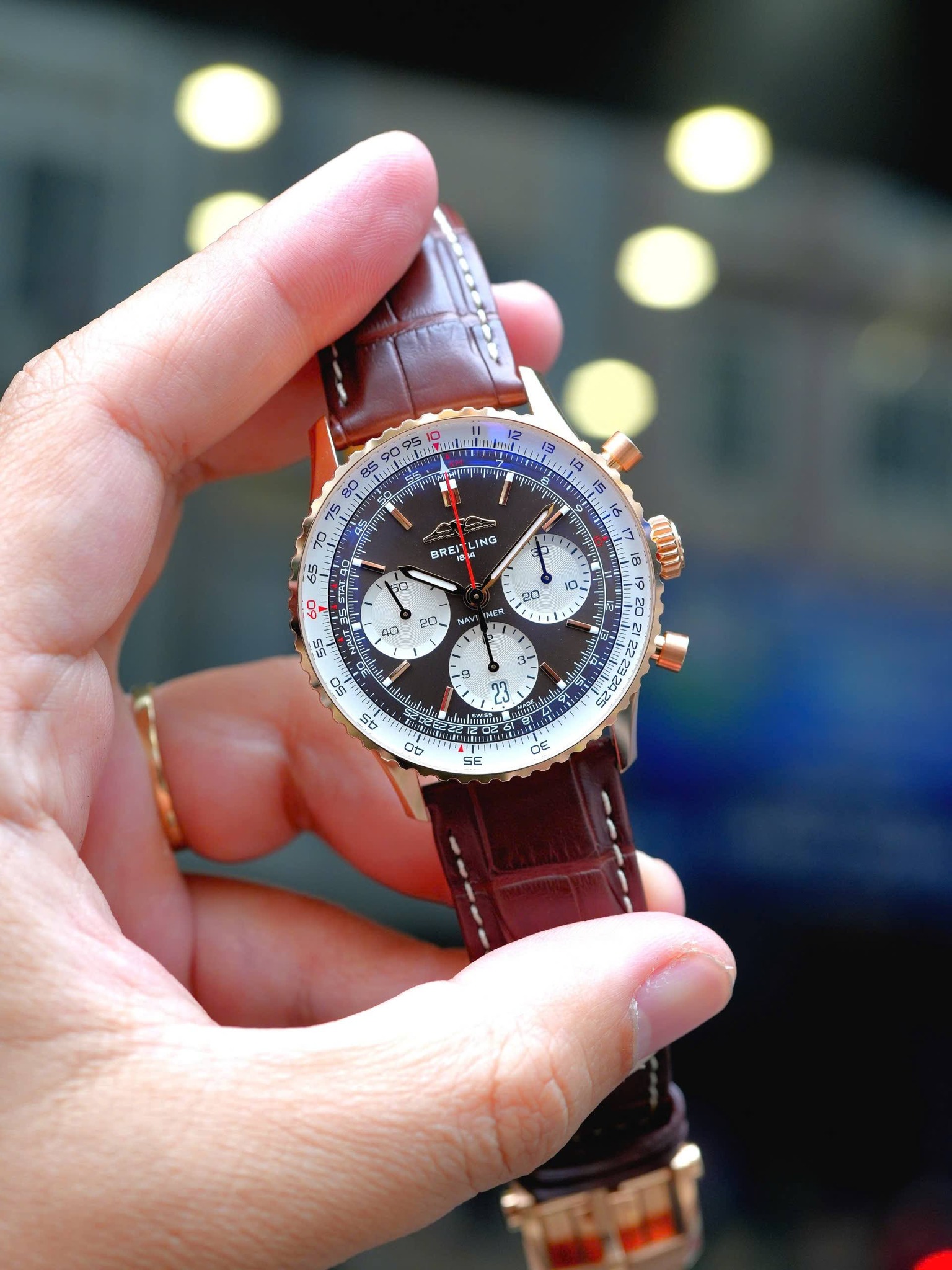 May be an image of wrist watch and text
