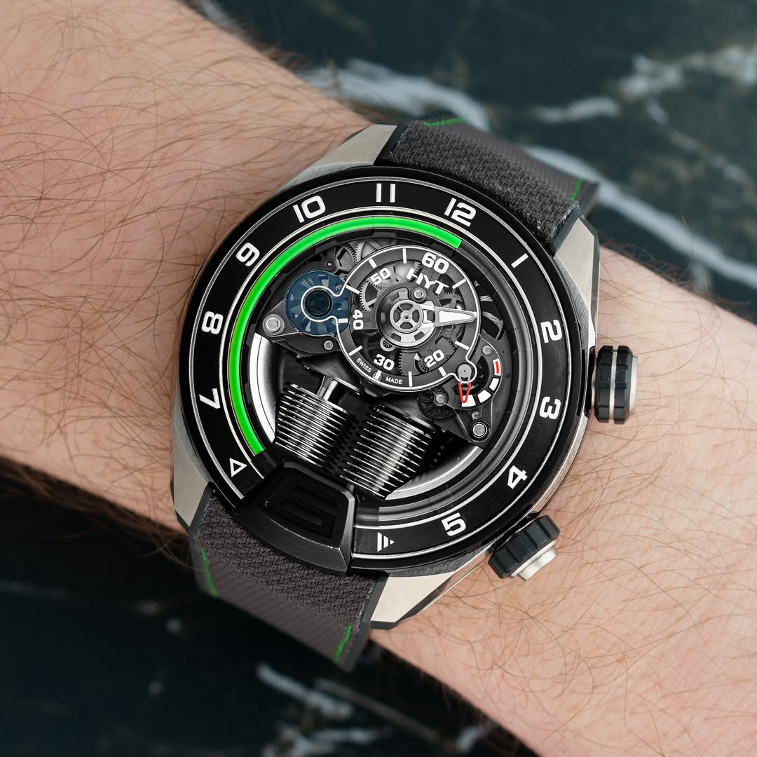 May be an image of wrist watch and text