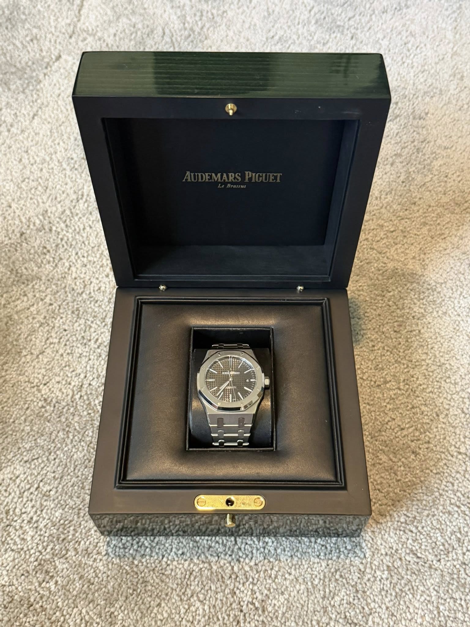 May be an image of wrist watch and text