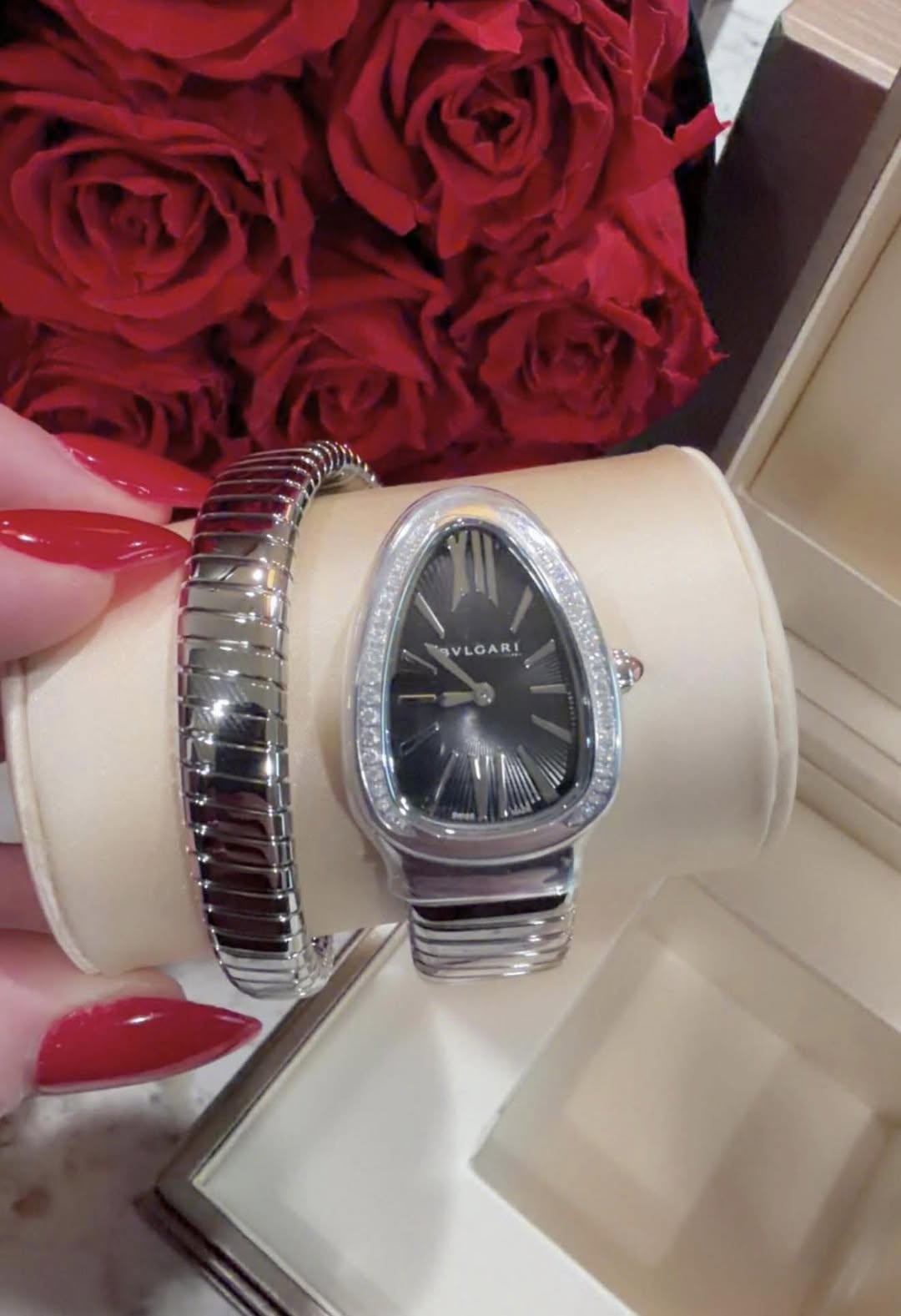 May be an image of wrist watch, jewelry and text that says 'SVLGARI SAR I'
