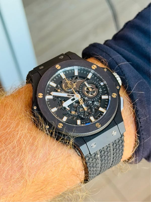 May be an image of wrist watch and text