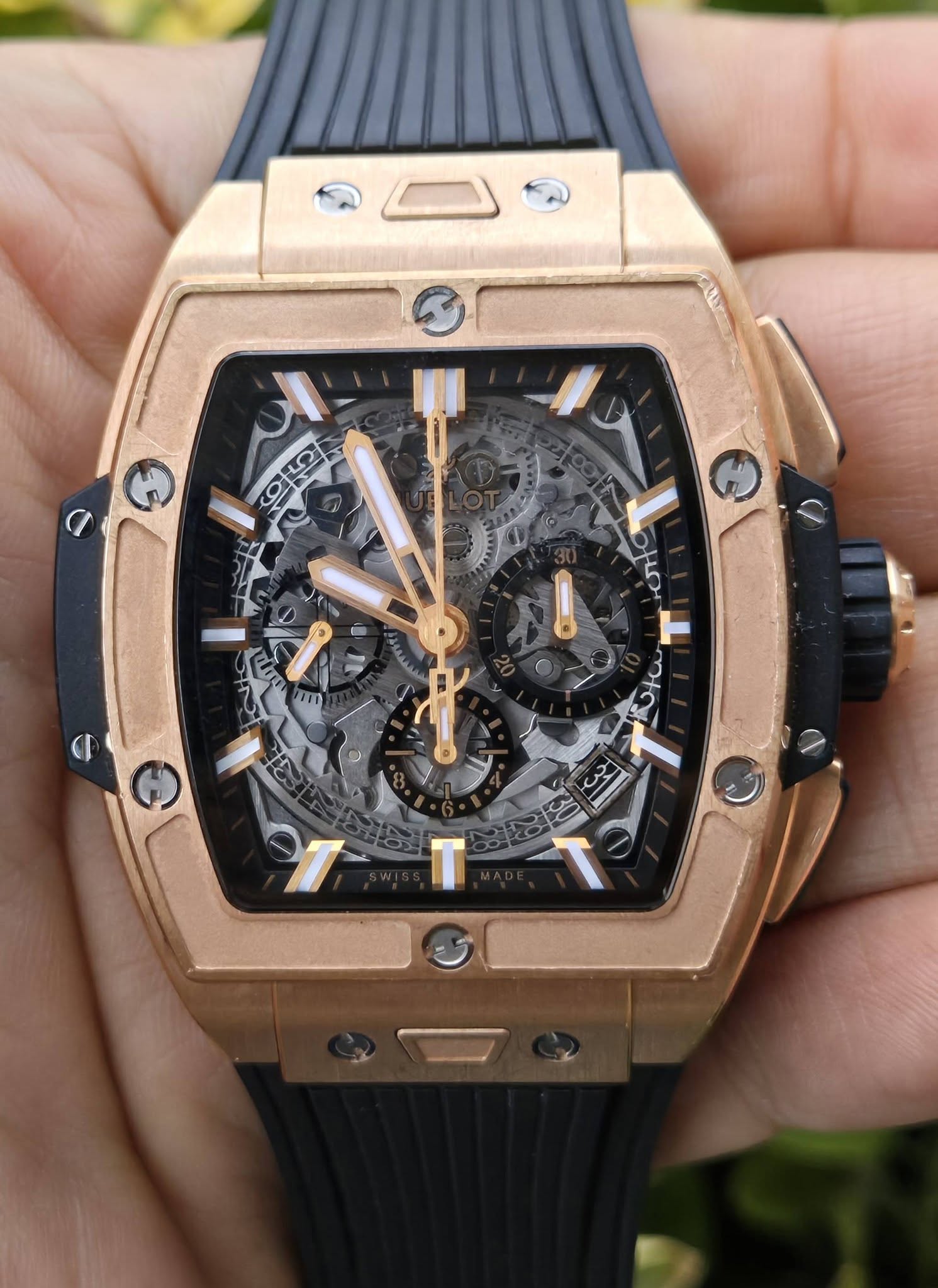 May be an image of wrist watch and text