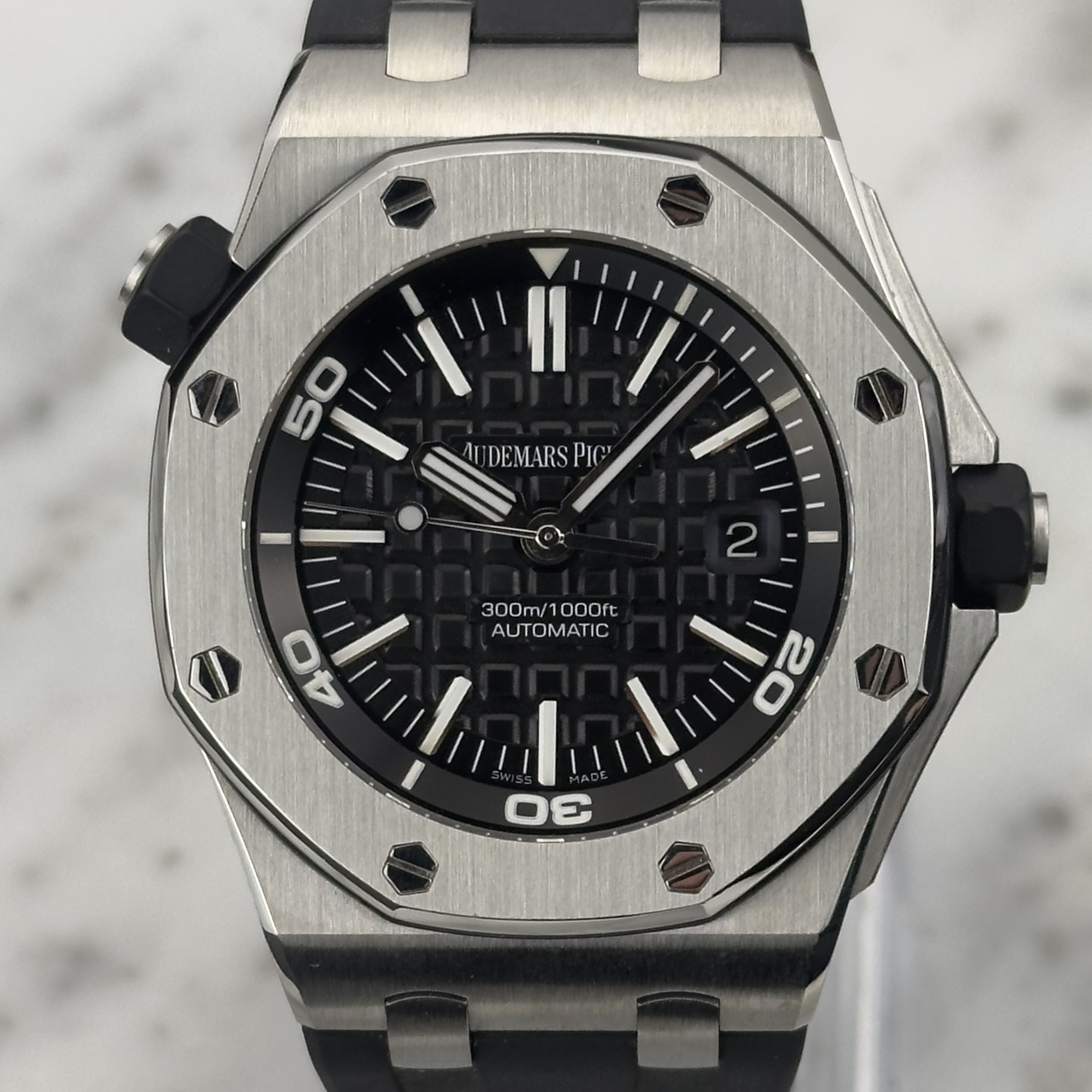 May be an image of wrist watch and text that says '50 DEMARS 2 300m 300m/1000ft 10 1000ft AUTOMATIC AU '